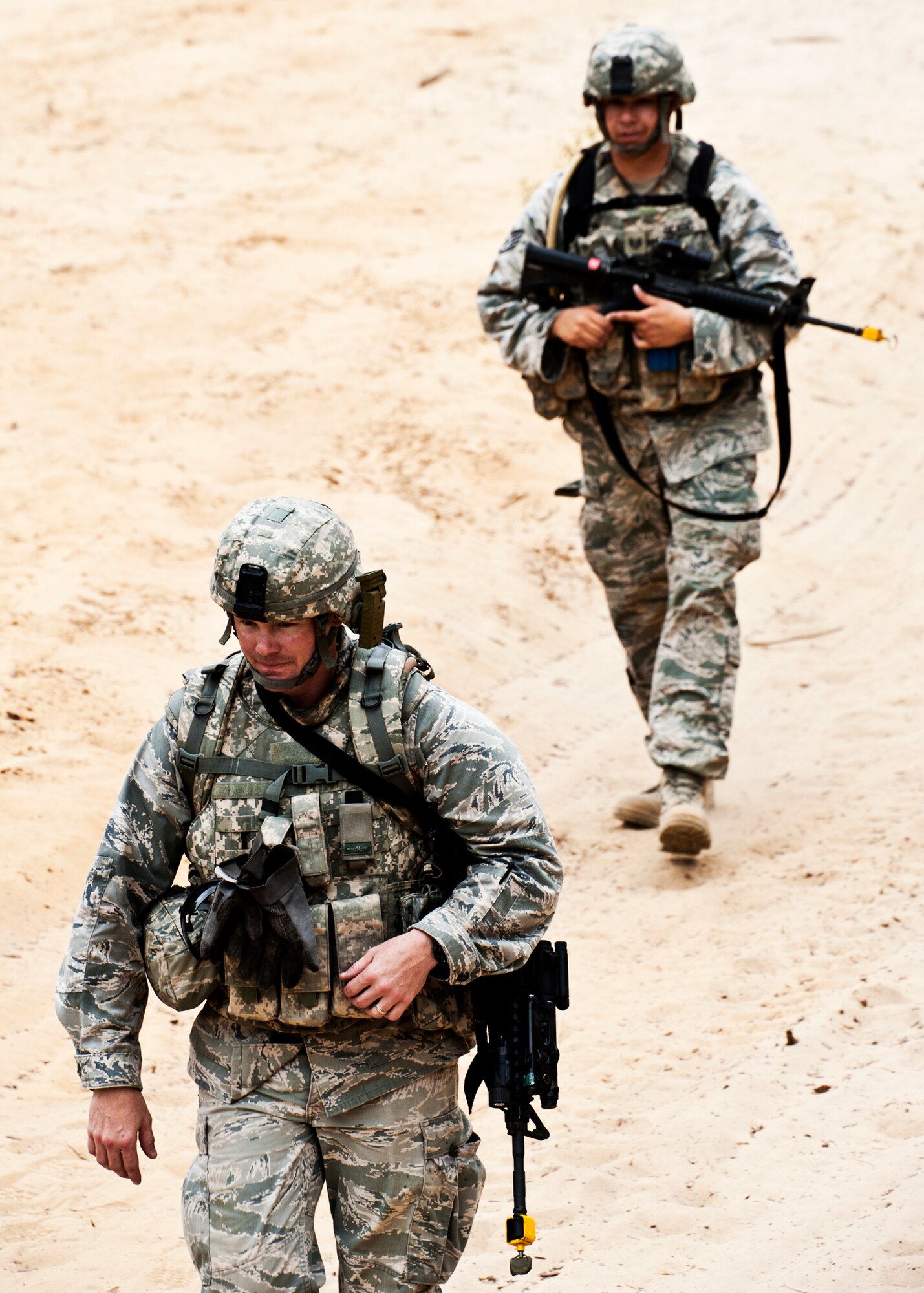 Maj. Justin Oldt, 99th Mission Support Group, leads the way during a simulated counter-insurgency mission April 27 at Eglin Air Force Base, Fla.  Squads of security forces Airmen were sent into simulated villages to mingle with locals, gather intelligence and familiarize themselves with their surroundings.  This was part of Air Force Materiel Command’s "Brave Defender" training, which is administered by the 96th Ground Combat Training Squadron.  GCTS instructors push 10 training classes a year, which consists of improvised explosive device detection and reaction, operating in an urban environment, mission planning, land navigation and casualty care.  More than 140 Airmen from more than 12 locations attended this training.  (U.S. Air Force photo/Samuel King Jr.)