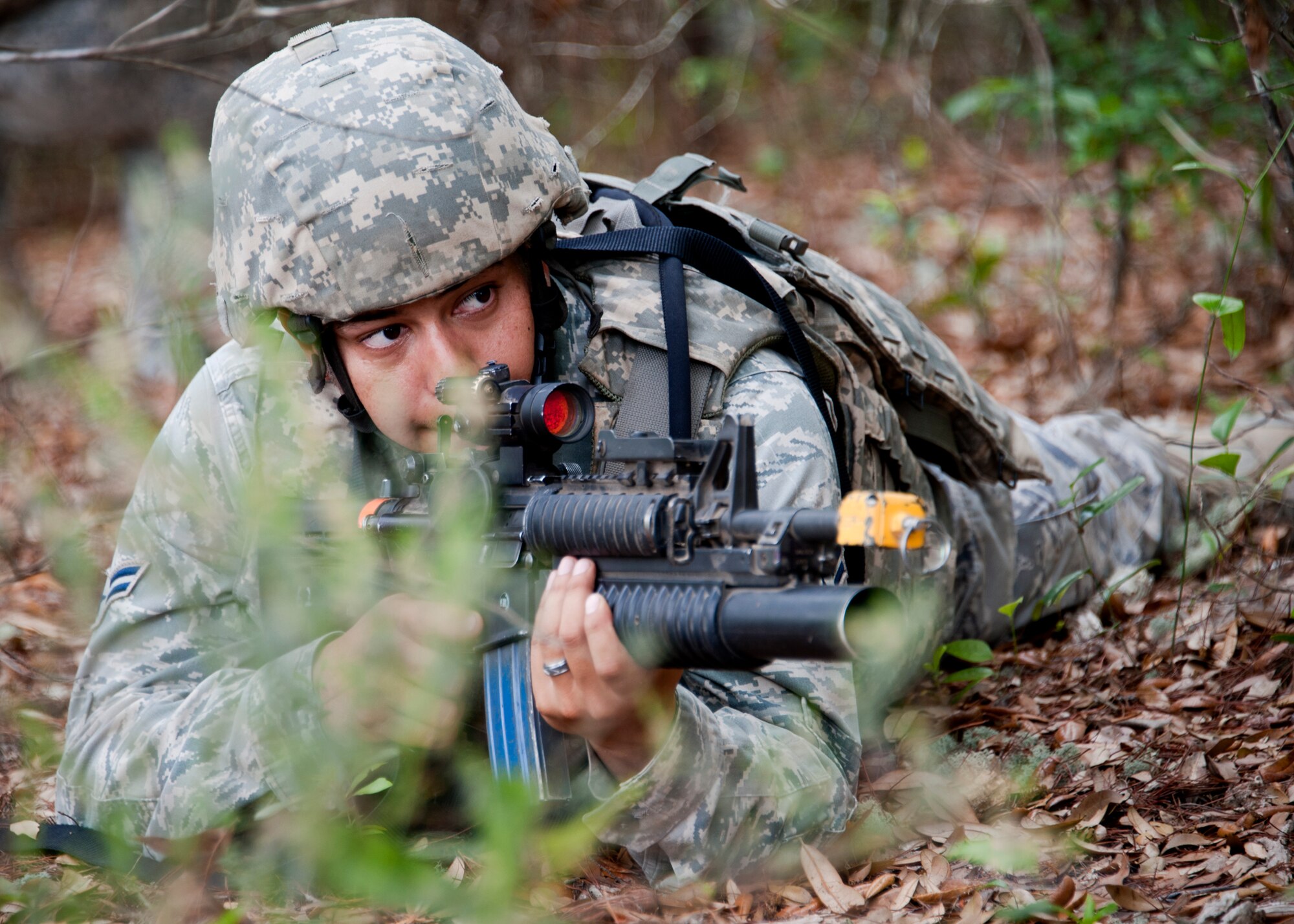 An Airman guards a perimeter around his squad during a movement ‘outside the wire’ April 27 at Eglin Air Force Base, Fla.  This was part of Air Force Materiel Command’s "Brave Defender" training, which is administered by the 96th Ground Combat Training Squadron.  GCTS instructors push 10 training classes a year, which consists of improvised explosive device detection and reaction, operating in an urban environment, mission planning, land navigation and casualty care. More than 140 Airmen from more than 12 locations attended this training.  (U.S. Air Force photo/Samuel King Jr.)