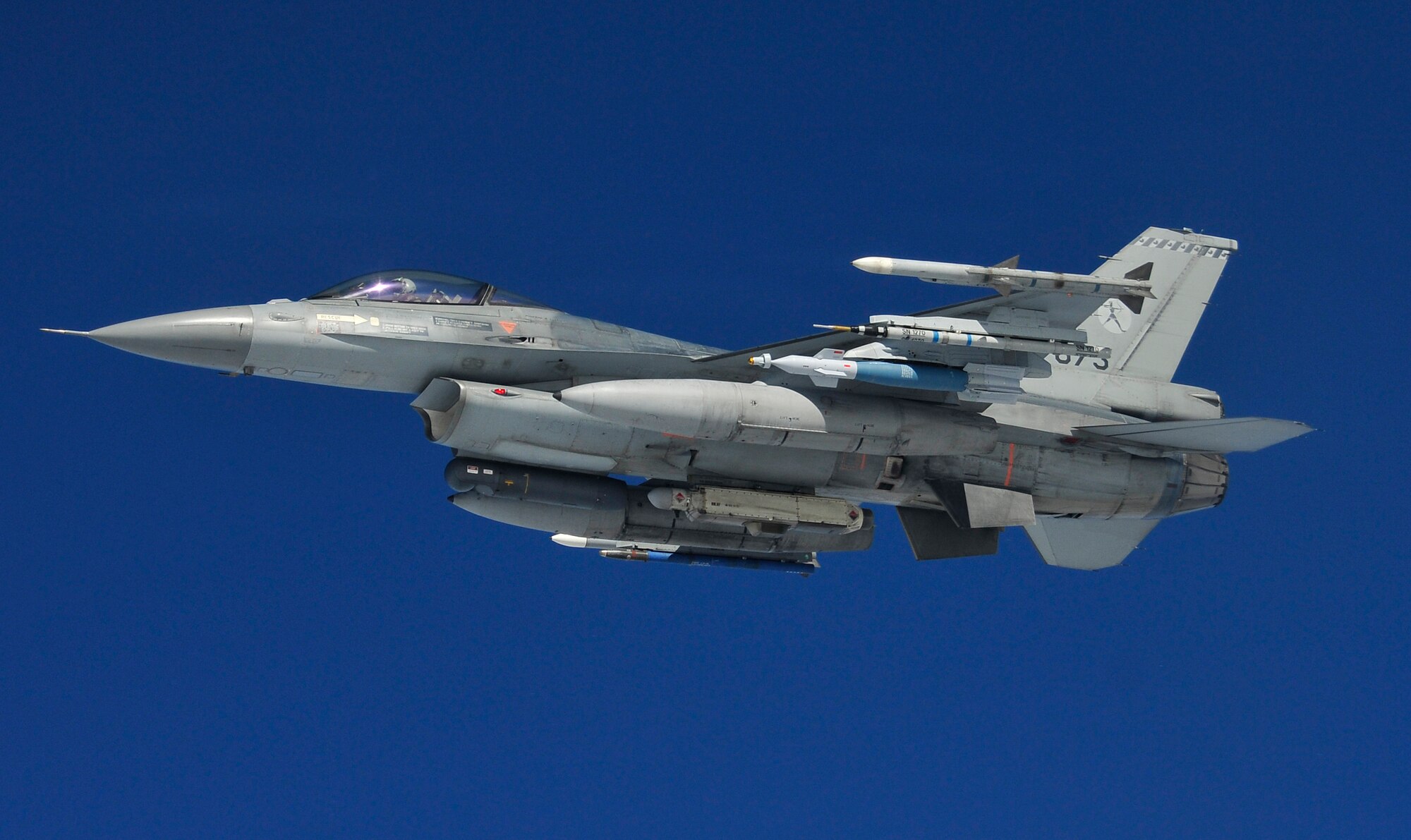 A Royal Netherlands air force F-16A flies by a KC-135 Stratotanker after being refueled over the Joint Pacific Alaska Range Complex during RED FLAG-Alaska 11-1, April 28, 2011.  The JPARC covers more than 67,000 square miles and enables the military to have the largest air-ground training complex in America.  The F-16A is assigned to Lee Leeuwarden Air Base, Netherlands and the KC-135 is assigned to the 92nd Air Refueling Wing, Fairchild Air Force Base, Wash.  (U.S. Air Force photo/Staff Sgt. Miguel Lara III)