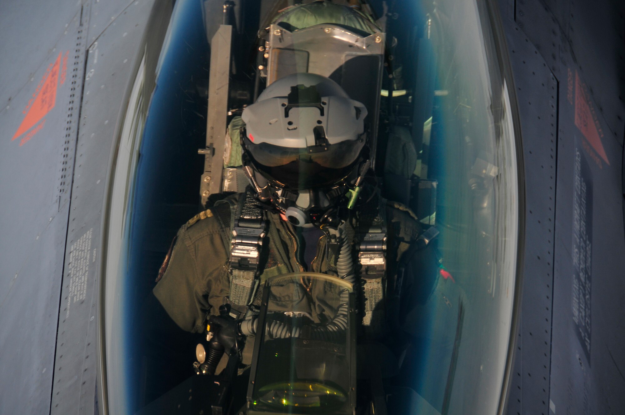 A Royal Netherlands air force F-16A pilot waits as a KC-135 Stratotanker refuels the jet over the Joint Pacific Alaska Range Complex during RED FLAG-Alaska 11-1, April 28, 2011.  The JPARC covers more than 67,000 square miles and enables the military to have the largest air-ground training complex in America.  The F-16A is assigned to Lee Leeuwarden Air Base, Netherlands and the KC-135 is assigned to the 92nd Air Refueling Wing, Fairchild Air Force Base, Wash.  (U.S. Air Force photo/Staff Sgt. Miguel Lara III)