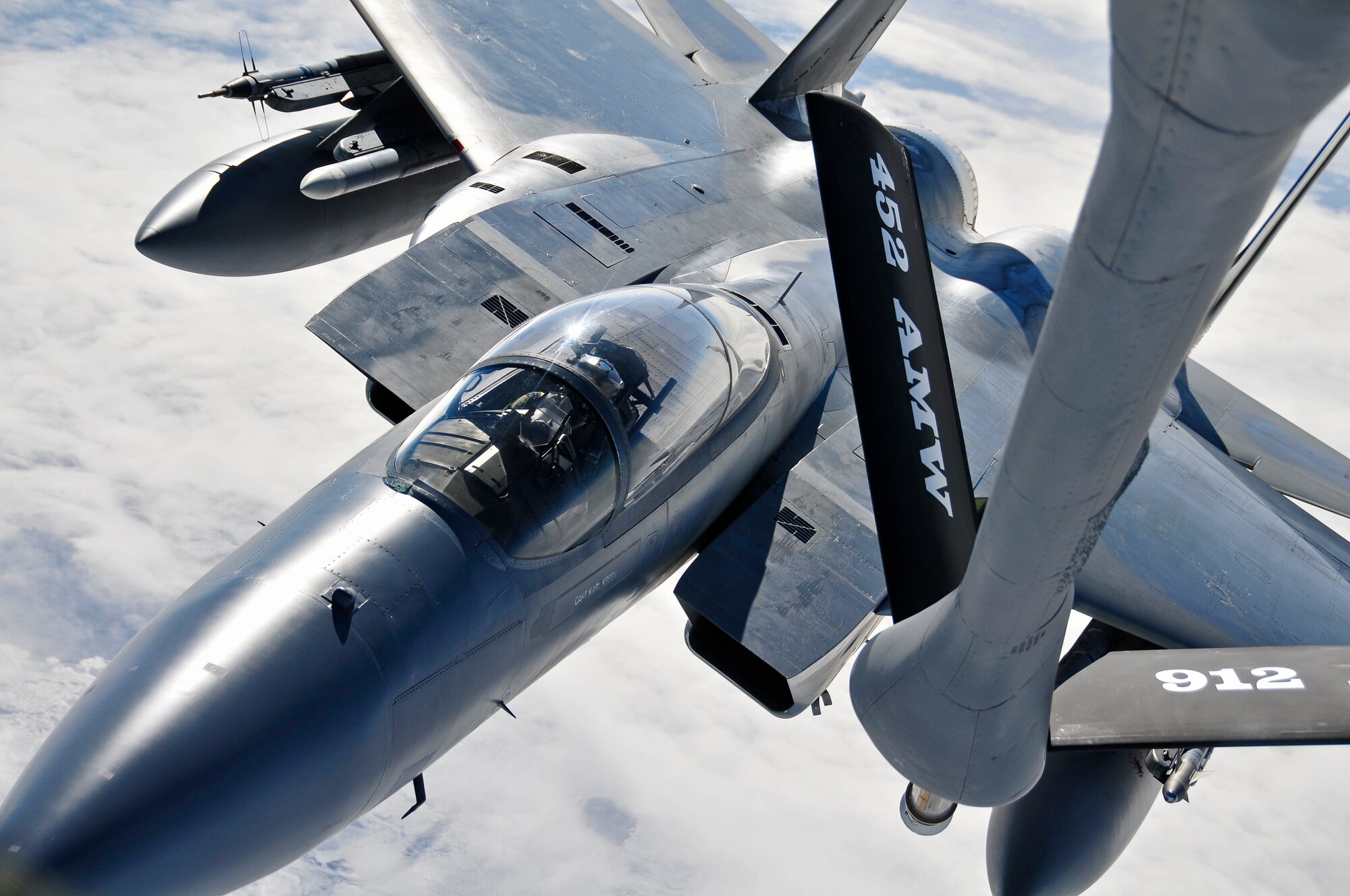 A KC-135 Stratotanker provides aerial refueling to an F-15 Eagle over the Joint Pacific Alaska Range Complex during RED FLAG-Alaska 11-1, April 28, 2011.  The JPARC covers more than 67,000 square miles and enables the military to have the largest air-ground training complex in America.  The F-15 is assigned to the 44th Fighter Squadron, Kadena Air Base, Japan and the KC-135 is assigned to the 92nd Air Refueling Wing, Fairchild Air Force Base, Wash. (U.S. Air Force photo/Staff Sgt. Miguel Lara III)