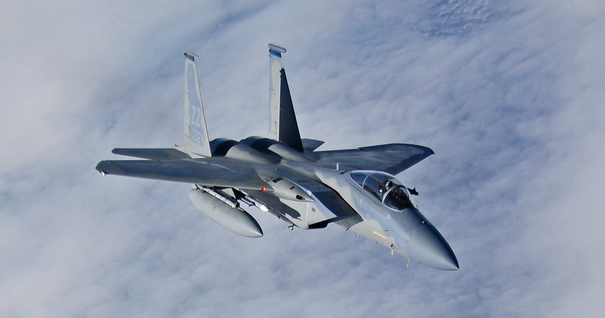 An F-15 Eagle flies by a KC-135 Stratotanker after being refueled over the Joint Pacific Alaska Range Complex during RED FLAG-Alaska 11-1, April 28, 2011.  The JPARC covers more than 67,000 square miles and enables the military to have the largest air-ground training complex in America.  The F-15 is assigned to the 44th Fighter Squadron, Kadena Air Base, Japan and KC-135 is assigned to the 92nd Air Refueling Wing, Fairchild Air Force Base, Wash. (U.S. Air Force photo/Staff Sgt. Miguel Lara III)