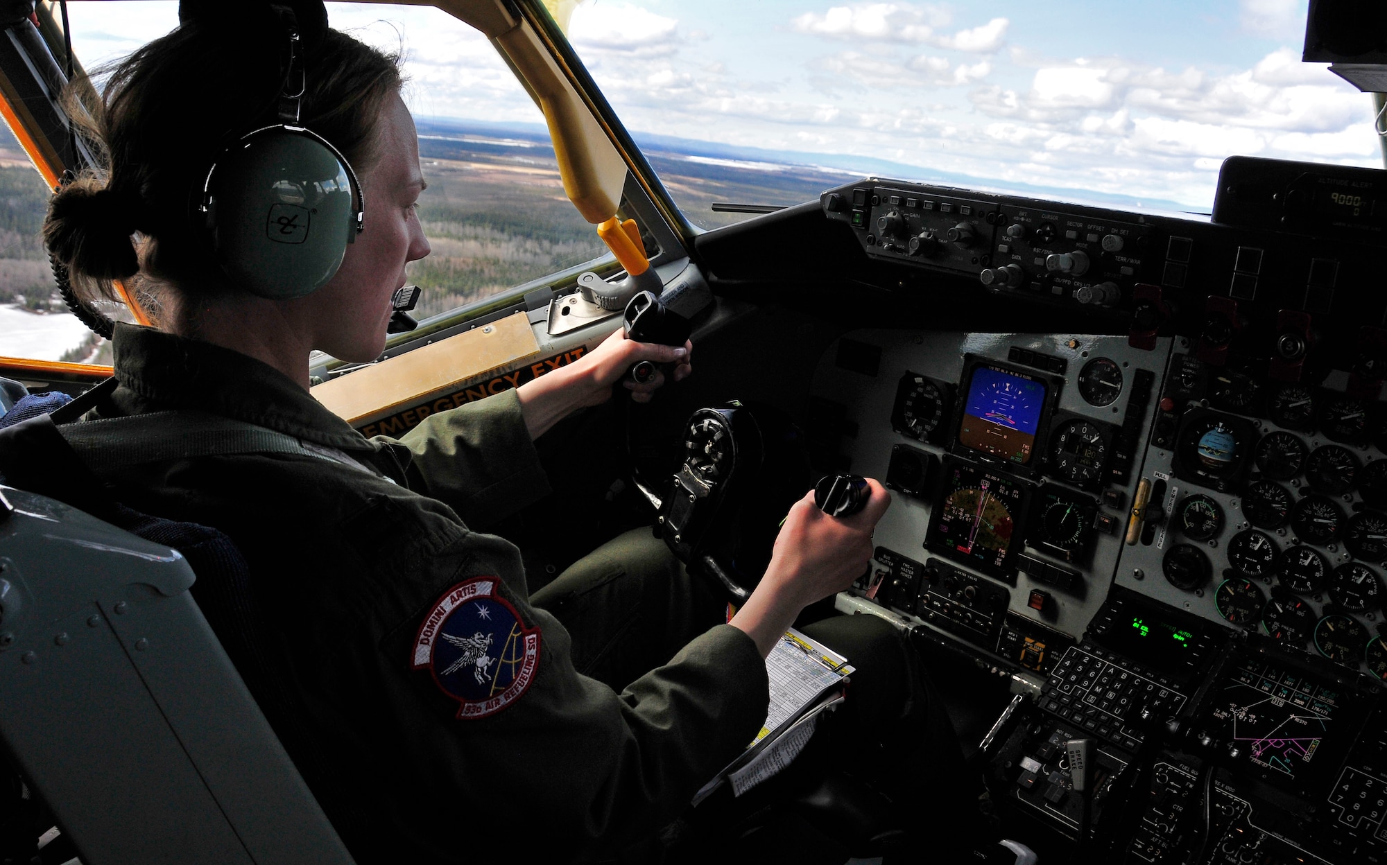 Capt. Brittany Gilmer pilots a KC-135 Stratotanker over the Joint Pacific Alaska Range Complex during RED FLAG-Alaska 11-1, April 28, 2011.  The JPARC covers more than 67,000 square miles and enables the military to have the largest air-ground training complex in America.  Captain Gilmer is a KC-135 pilot assigned to the 92nd Air Refueling Wing, Fairchild Air Force Base, Wash.  (U.S. Air Force photo/Staff Sgt. Miguel Lara III)Miguel Lara III)