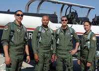 LAUGHLIN AIR FORCE BASE, Texas –– First Lt. Taylor Wight, 85th Flying Training Squadron, and Capt. Scott Doyer, 85th FTS, pose for a photo with Tech. Sgt. Kenya Fairley, 324th Training Squadron, and Tech. Sgt. April Ramirez, 324th TRS, after completing incentive rides in T-6 aircraft. The 85th FTS has established a "sister squadron" relationship with the 324th TRS, which is a Basic Military Training squadron from Lackland Air Force Base. In an effort to foster this relationship, members of the 85th FTS have traveled to Lackland to experience different aspects of today's BMT.The 85th FTS hosted a similar event here April 28 and 29 and gave incentive flights to Military Training Instructors. (U.S. Air Force photo by Jose Mendoza)  

