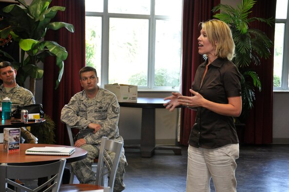Julie Miller, Hurlburt Field Spouses' Club member, talks to the Focus 5/6 group, a council made up of staff and technical sergeants, about the HSC organization at the Landing Zone on Hurlburt Field, Fla., April 19, 2011. Mrs. Miller informed the group about the HSC's benefits and activities, and encouraged members to tell their spouses about the club. (U.S. Air Force photo by Staff Sgt. Sarah Martinez/RELEASED)