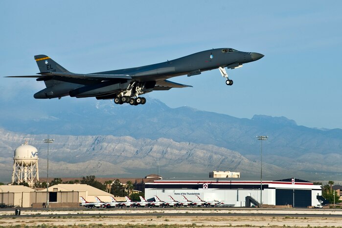NELLIS AIR FORCE BASE, Nev. -- A B-1B Lancer, 34th Bomb Squadron, Ellsworth AFB, S.D., departs for a training mission during exercise Green Flag West 11-6, April 28. Green Flag West replicates irregular warfare conditions currently found in Southwest Asia. Aircrews, work closely with Air Force joint terminal attack controllers. Pilots train for a missions such as close air support, and aerial reconnaissance.(U.S. Air Force photo by Senior Airman Brett Clashman)