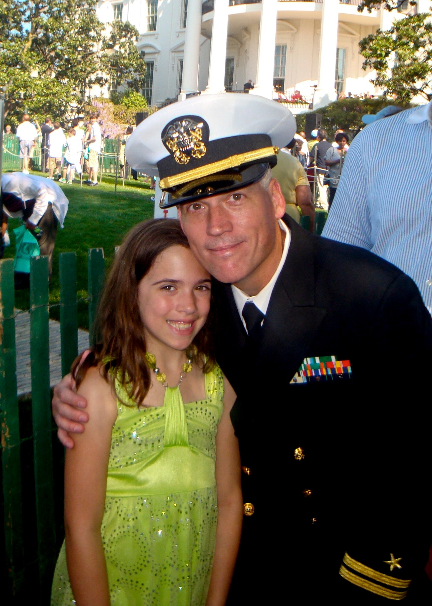 Brent Bassham, of the Armament Directorate and Navy reserve, poses with his daughter, Abigail, outside the White House lawn during the annual Easter celebration and egg roll. The First Family hosted 30,000 people from all 50 states in their backyard for the 133rd White House Easter Egg Roll and once again Eglin was on their invite list.  (Courtesy photo)
