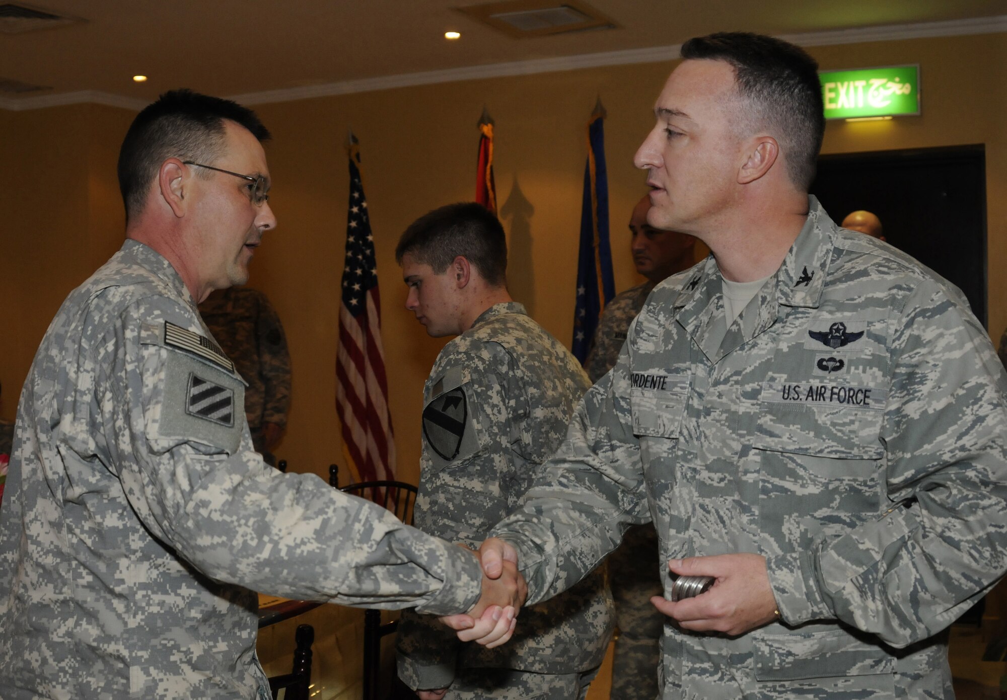Col. Patrick Mordente, 386th Air Expeditionary Wing commander, shakes hands with a U.S. Army Soldier at the 386th May 1. The Soldier was part of Operation Proper Exit, a program put together by the Troops First Foundation and the United Service Organization. The objective of the program is to bring closure to veterans wounded in combat and to show troops in the war zone that injuries sustained in battle are surmountable. (U.S. Air Force photo by Capt. Heath Allen)