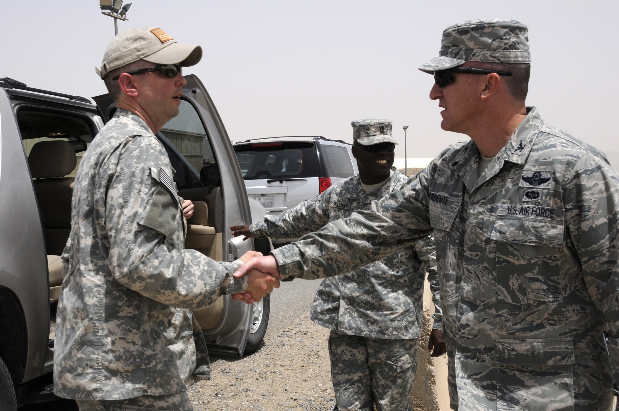 Col. Patrick Mordente, 386th Air Expeditionary Wing commander, shakes hands with a U.S. Army Soldier at the 386th May 1. The Soldier was part of Operation Proper Exit, a program put together by the Troops First Foundation and the United Service Organization. The objective of the program is to bring closure to veterans wounded in combat and to show troops in the war zone that injuries sustained in battle are surmountable. (U.S. Air Force photo by Capt. Heath Allen)