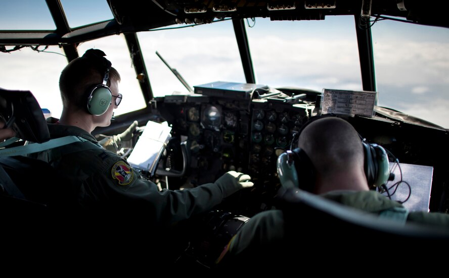PACIFIC OCEAN -- Capt. Gabe Frusha, 36th Airlift Squadron pilot, brings a C-130 Hercules back to cruising altitude after loadmasters dropped seven Davis Drifting Buoys into the Pacific Ocean April 29, 2011. (U.S. Air Force photo/Staff Sgt. Samuel Morse)