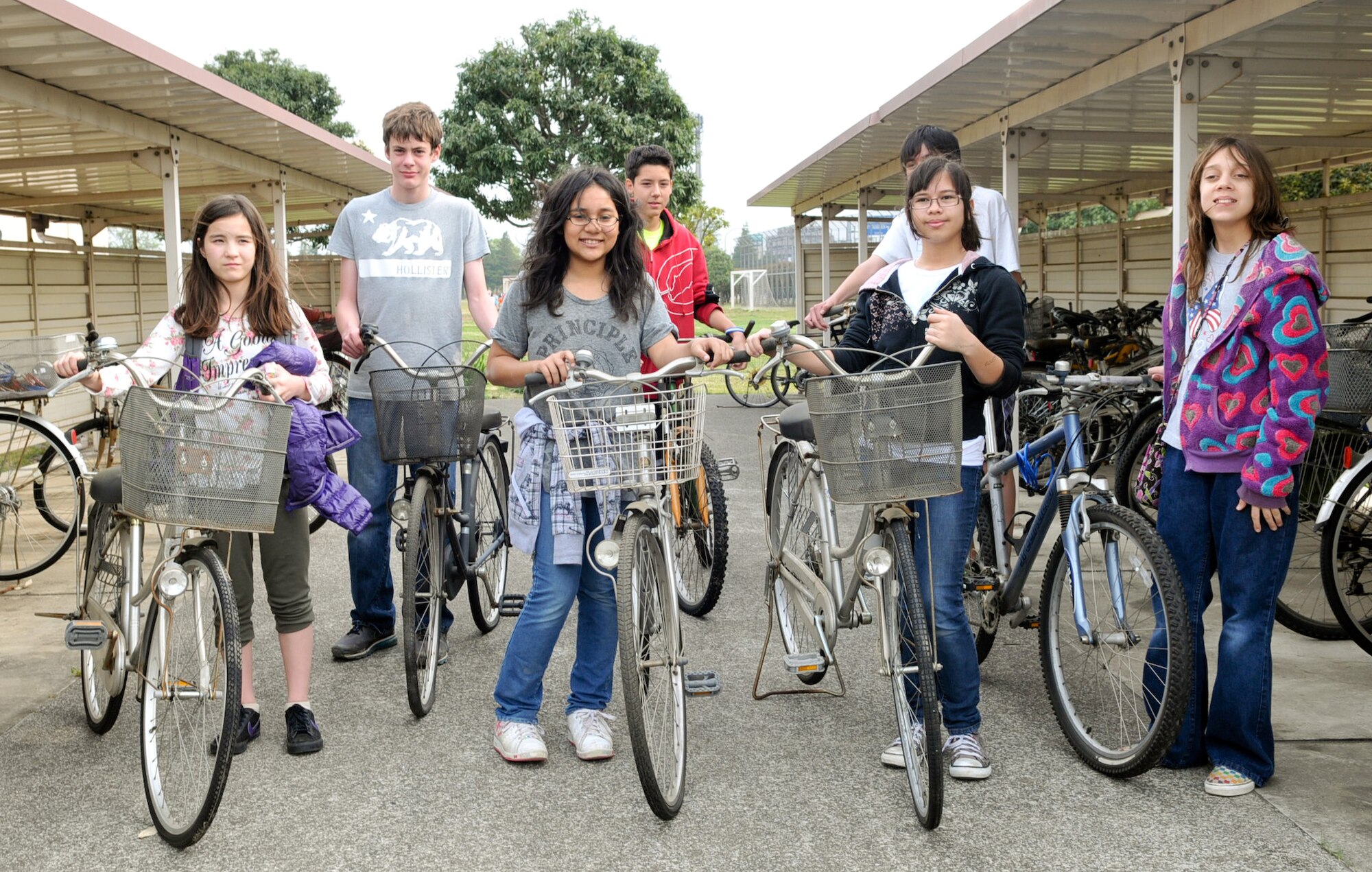 YOKOTA AIR BASE, Japan -- Roots and Shoots students and National Jr. Honor Society students at Yokota Middle School stand with bicycles at Yokota Air Base, Japan, April 27, 2011. The bicycles were donated to people affected by the natural disaster in northern Japan. (U.S. Air Force photo/Airman 1st Class Krystal M. Garrett)