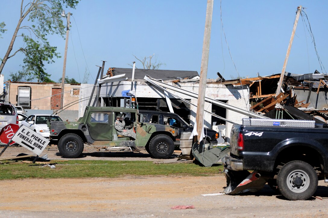 U.S. Army soldiers travel through Smithville, Miss., April 29, 2011, on search and security