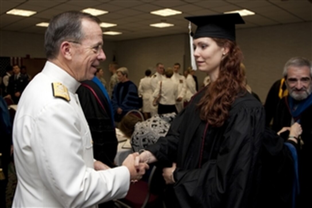 Chairman of the Joint Chiefs of Staff Adm. Mike Mullen, U.S. Navy, greets U.S. Army Staff Sgt. Shasha Maria-Martin prior to Florida State University 2011 Spring Commencement ceremonies in Tallahassee, Fla., on April 30, 2011.  Martin, a twice-deployed Iraq veteran, graduated with a degree in International Relations.  