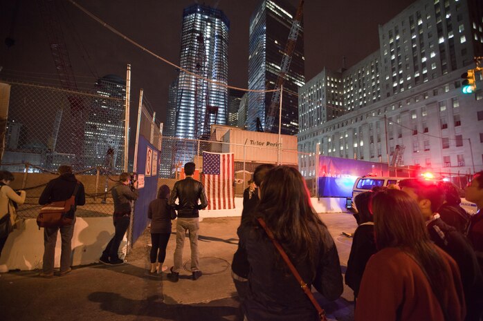 A crowd cheers and chants in excitement at the corner of Vesey St. and Liberty St. next to Ground Zero after hearing that Osama Bin Laden is dead. Bin Laden planned the attacks Sept 11, 2001 and has been hunted by American forces in the years since. He was killed by a raid in Abbottabad, Pakistan near the country's capital. The Freedom Tower, the skyscraper being built where the World Trade Center towers once stood, is now 60 stories tall and was lit up and visible from the street. Eventually the Freedom Tower will be the tallest building in the country.