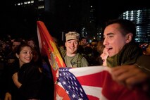 A crowd cheers and chants in excitement at the corner of Vesey St. and Liberty St. next to Ground Zero after hearing that Osama Bin Laden is dead. Bin Laden planned the attacks, Sept 11, 2001 and has been hunted by American forces in the years since. He was killed by a raid in Abbottabad, Pakistan near the country's capital. The Freedom Tower, the skyscraper being built where the World Trade Center towers once stood, is now 60 stories tall and was lit up and visible from the street. Eventually the Freedom Tower will be the tallest building in the country.
