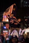 A crowd cheers and chants in excitement at the corner of Vesey St. and Liberty St. next to Ground Zero after hearing that Osama Bin Laden is dead. Bin Laden planned the attacks, Sept 11, 2001 and has been hunted by American forces in the years since. He was killed by a raid in Abbottabad, Pakistan near the country's capital. The Freedom Tower, the skyscraper being built where the World Trade Center towers once stood, is now 60 stories tall and was lit up and visible from the street. Eventually the Freedom Tower will be the tallest building in the country.
