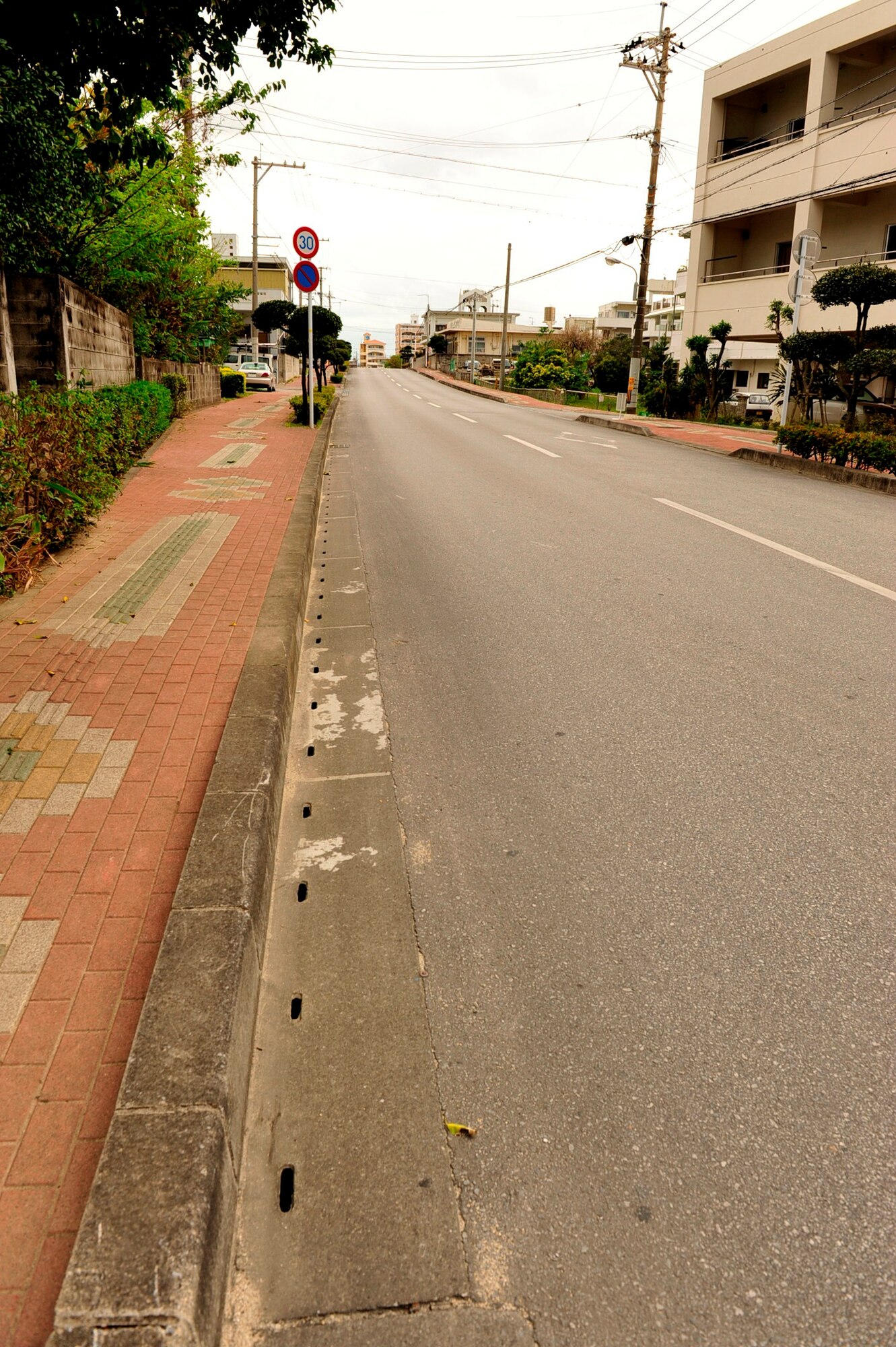 The street shown is one of the streets leading to Sunabe Baba Park in Chatan Town.  Skating and other activities alike are only allowed in designated areas inside the park. (U.S. Air Force photo/Senior Airman Sara Csurilla)