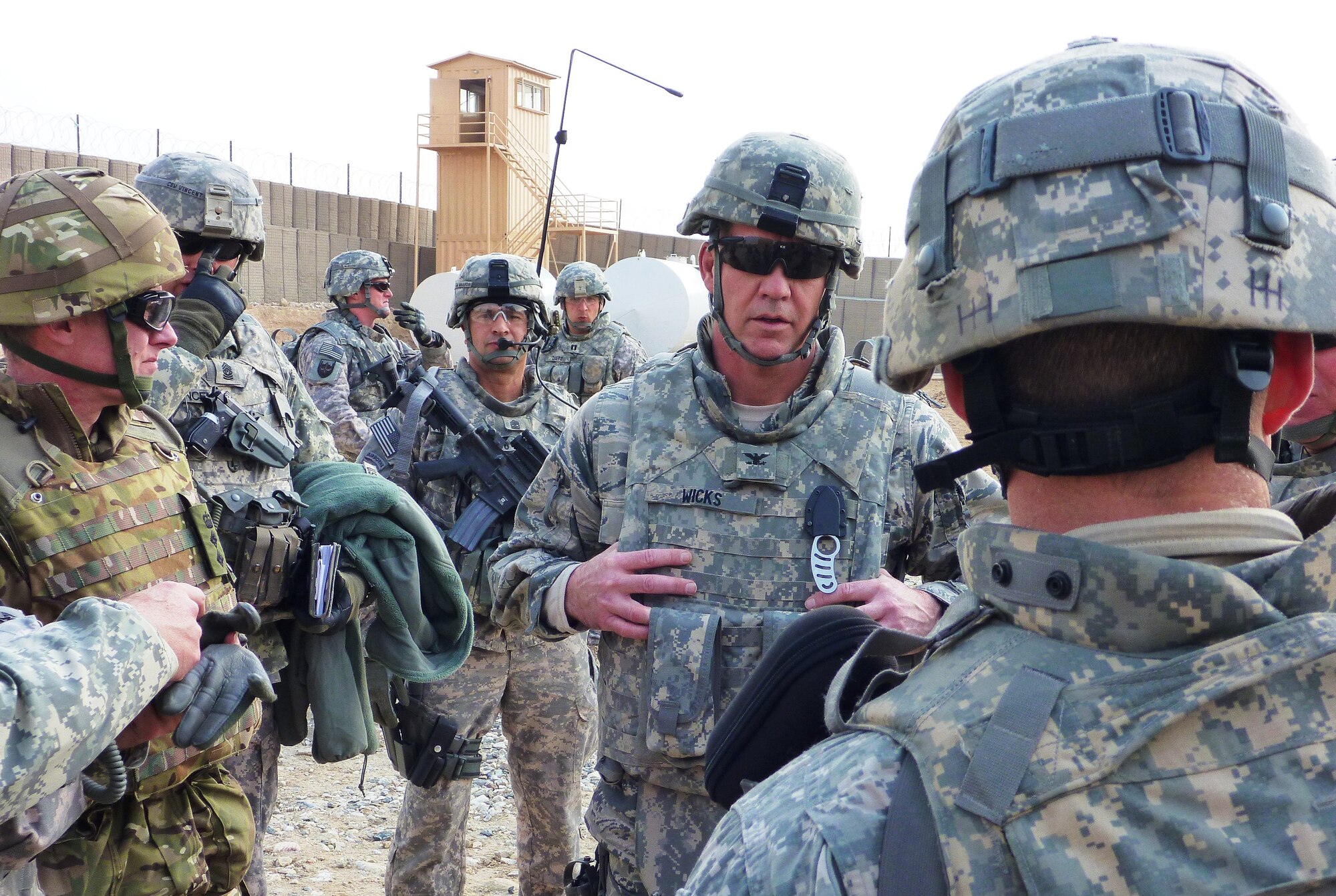 Col. Bob Wicks, commander of RSC-Capital, receives a brief on the construction status at Forward Operating Base Bhut Khak Feb. 15. Bhut Khak opened April 24 and is a new Afghan National Army installation in eastern Kabul. The new $4.4 million facility will house the 600 soldiers of the 3rd Kandhak, 1st Brigade, who are responsible for the security throughout the eastern corridor of Kabul. (Photo by Jon Connor)