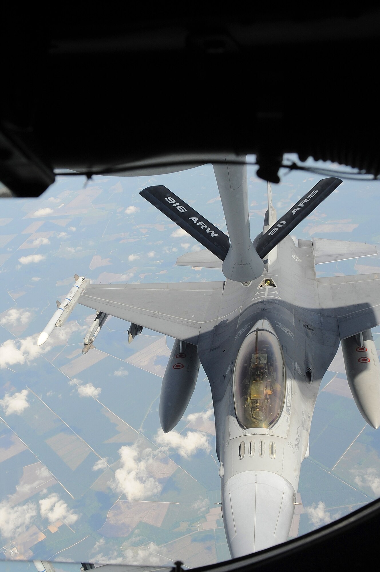 SEYMOUR JOHNSON AIR FORCE BASE, N.C. -- An F-16CJ Fighting Falcon refuels mid-air from a KC-135 Stratotanker during a large force exercise over North Carolina May 2, 2011. Forty two aircraft, including the Viper Squadron from Shaw Air Force Base, S.C., participated in the exercise. (U.S. Air Force photo/Senior Airman Gino Reyes)
