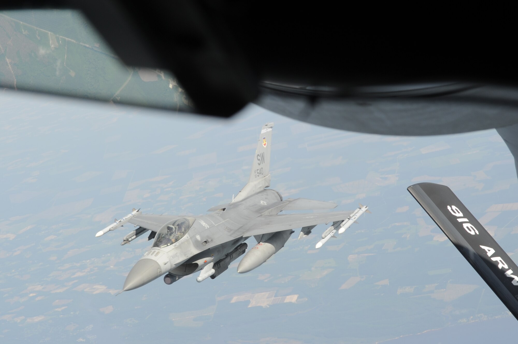 SEYMOUR JOHNSON AIR FORCE BASE, N.C. -- An F-16CJ Fighting Falcon refuels mid-air from a KC-135 Stratotanker during a large force exercise over North Carolina May 2, 2011. Forty two aircraft, including the Viper Squadron from Shaw Air Force Base, S.C., participated in the exercise. (U.S. Air Force photo/ Senior Airman Gino Reyes)

