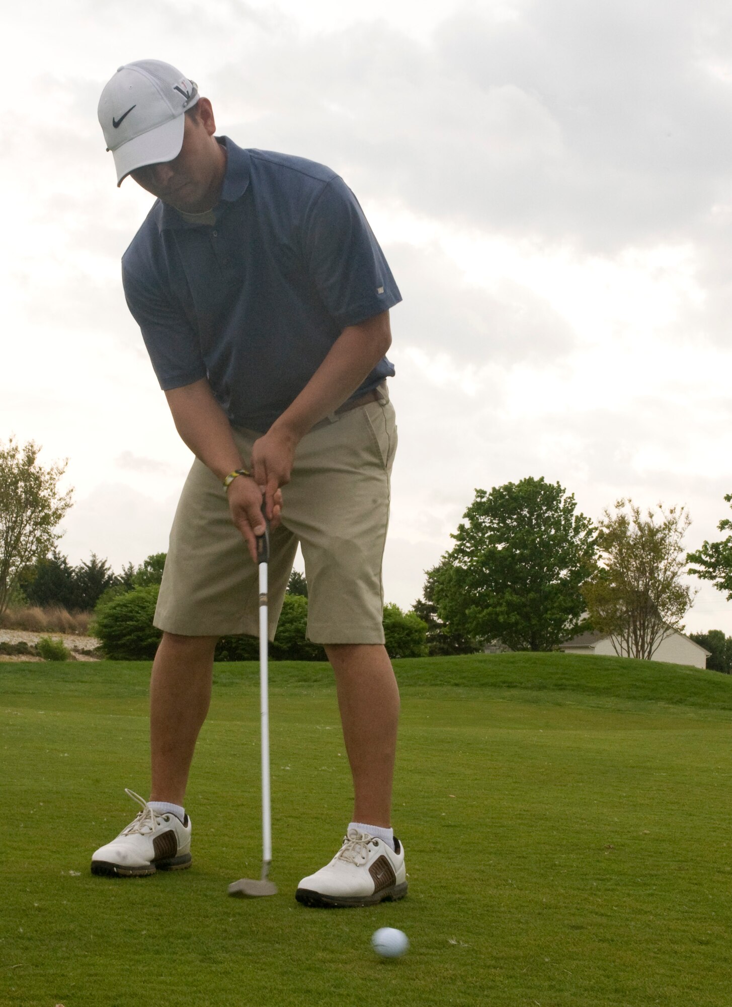 Senior Airman David Lopez attempts a putt April 28, 2011, during the Central Delaware Chamber of Commerce Bluesuiters Golf Tournament at the Jonathan’s Landing Golf Course in Magnolia, Del. The tournament brought together servicemembers from Dover Air Force Base, Del., and members of the local community on the course to participate in a round of golf. (U.S. Air Force photo by Steve Kotecki)
