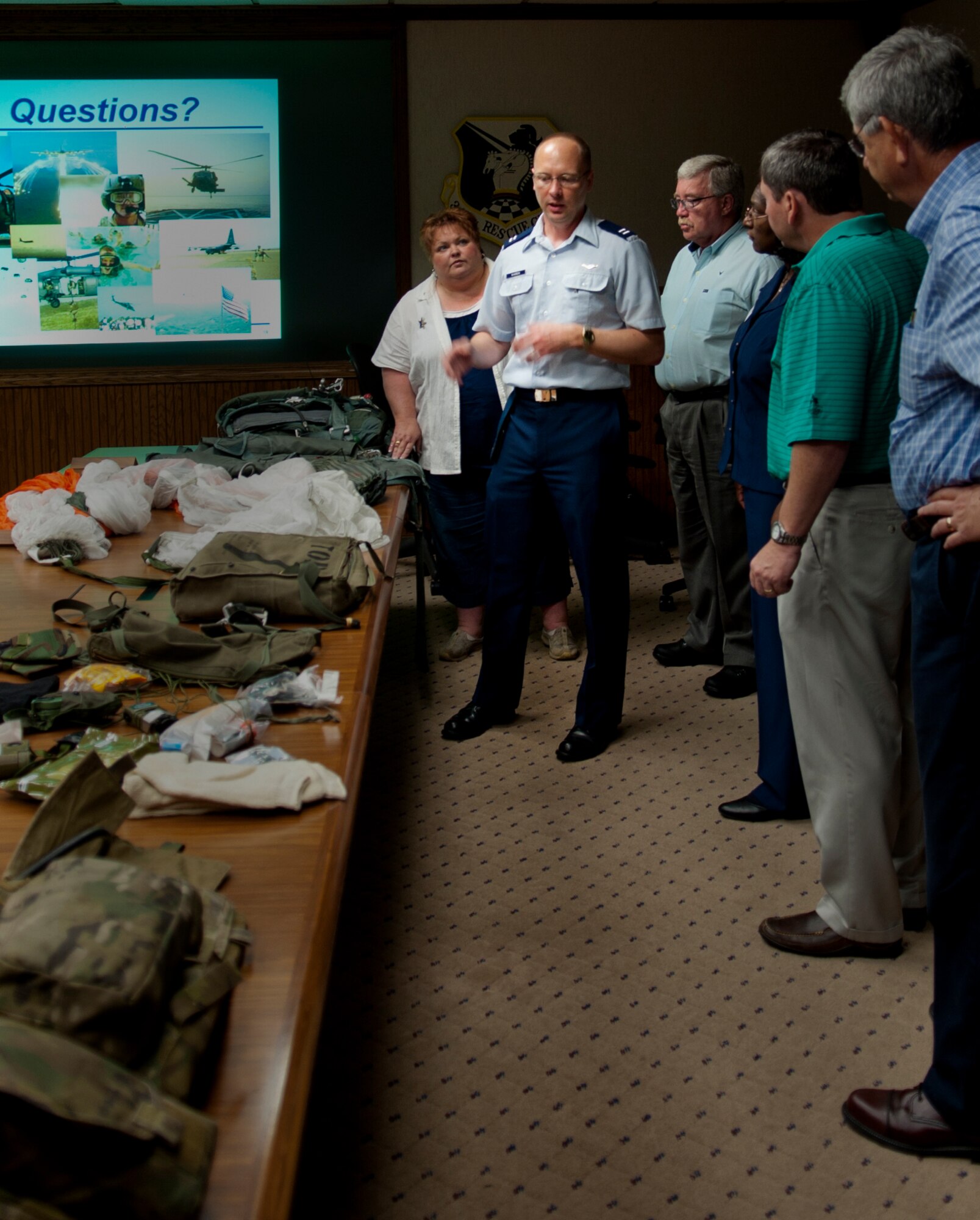MOODY AIR FORCE BASE, Ga. -- Capt. David Warren, 347th Operation Support Squadron aircrew flight equipment commander, answers questions about life-support equipment during the Military Affairs Committee base tour May 2. Capt. Warren explained to the members how different types of equipment work. (U.S. Air Force photo/Staff Sgt. Melissa K. Mekpongsatorn)(RELEASED)
