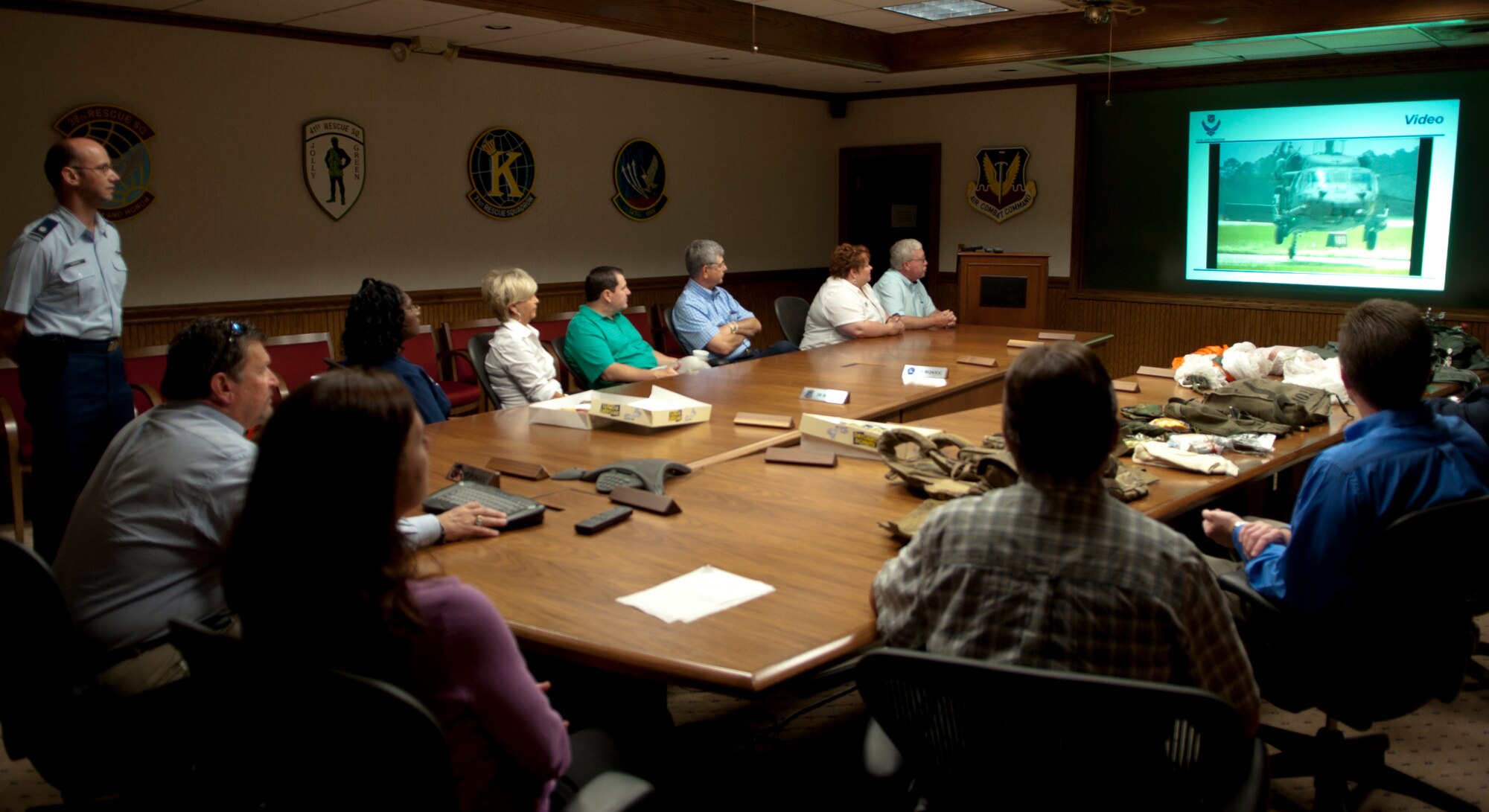 MOODY AIR FORCE BASE, Ga. – Eleven members of the Military Affairs Committee sit down to watch a Moody mission video during their base tour May 2. The video showed them what Moody’s aircraft are capable of doing. (U.S. Air Force photo/Staff Sgt. Melissa K. Mekpongsatorn)(RELEASED)
