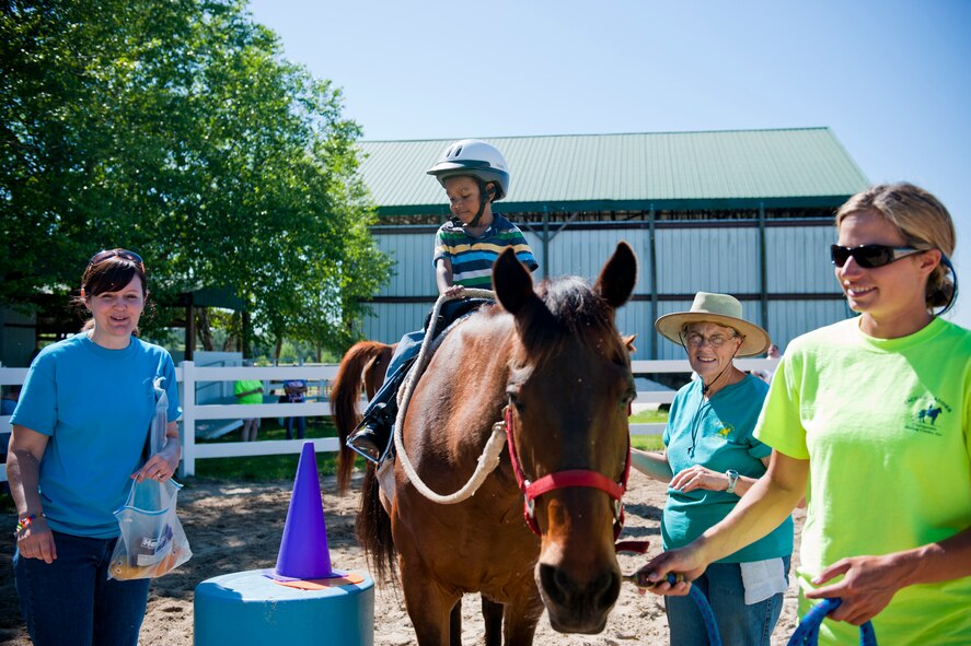 Joseph Williams IV, son of Staff Sgt. Joseph Williams III, 23rd Maintenance Operations Squadron, rides a horse April 30 at Jacobs’ Ladder Therapeutic Riding Center in Hahira, Ga. The event was the first of its kind. The Moody Airman and Family Readiness Center hopes to make it an annual event to occur each April during the Month of the Military Child. (U.S. Air Force photo/Staff Sgt. Jamal D. Sutter)(RELEASED)