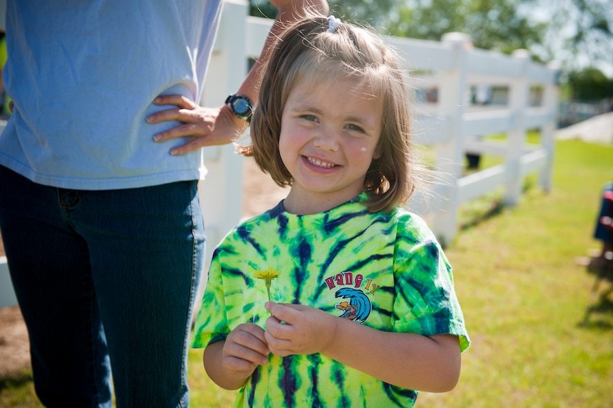 Kyra Hoover, daughter of Tech. Sgt. Jessica Hoover, 23rd Force Support Squadron, smiles for the camera after receiving a horse ride April 30 at Jacobs’ Ladder Therapeutic Riding Center in Hahira, Ga. Jacobs’ Ladder is a facility that provides equine related activities to individuals with special needs. For many of the children, it was their first time riding a horse. (U.S. Air Force photo/Staff Sgt. Jamal D. Sutter)(RELEASED)