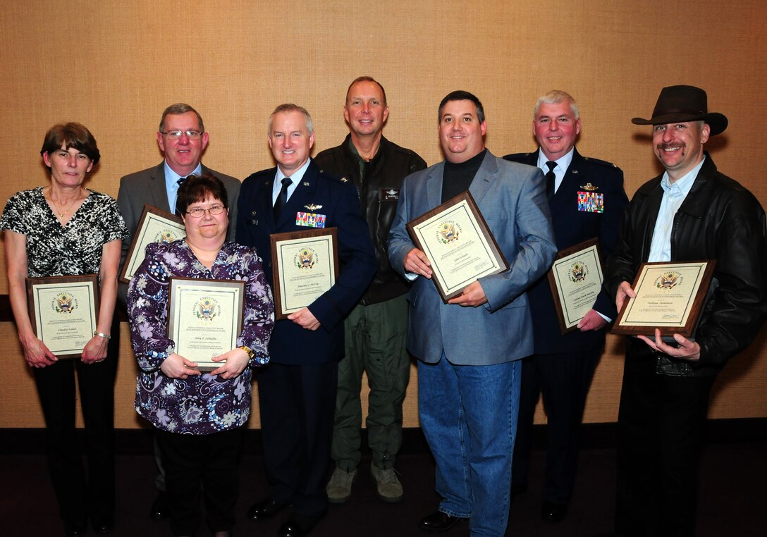 BUFFALO, N.Y.- Members of the 914th Airlift Wing pose with their awards. The Buffalo Federal Executive Board's Excellence in Government Awards Ceremony was held at the Buffalo Convention Center.  The 914th Airlift Wing was among many  other federal agencies represented. The winners this year posed with wing commander Colonel Alan Swartzmiller (center) and are (left to right) Ms.Claudia Scalzo, lead travel technician who received the Direct Customer Service Award.  Chief Master Sgt. (retired) Don Platts, medical administrative specialist, received the Chairman's Award for Continuous Excellence.  Ms. Amy Zebulske, management assistant, received the Outstanding Administrative Support Award.  Colonel Tim McCoy, mission support group commander, received the Distinguished Government Service Award.  Mr. John Schultz, fire inspector and Mr. William Tiedeman, firefighter (last on right) both received the Community Service Award.  Colonel Mark Murphy, vice commander received the Excellence in Workforce Development Award.  Congratulations to all. (U.S. Air Force Reserve photo by Peter Borys)
