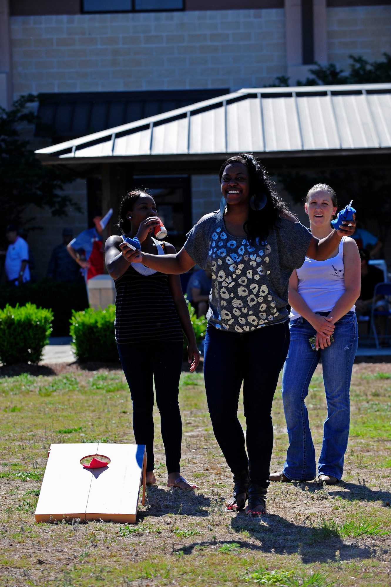 U.S. Air Force Airman 1st Class Barrye Collins, 1st Special Operations Maintenance Operations Squadron, laughs after her opponents score three points in a game of Cornhole during a dormitory picnic, Hurlburt Field, Fla., April 28, 2011. Airmen enjoyed playing games, winning prizes and socializing with fellow Air Commandos. The picnic was hosted by the Fort Walton Beach Military Affairs Committee. (U.S. Air Force photo by Staff Sgt Julianne M. Showalter/Released)
