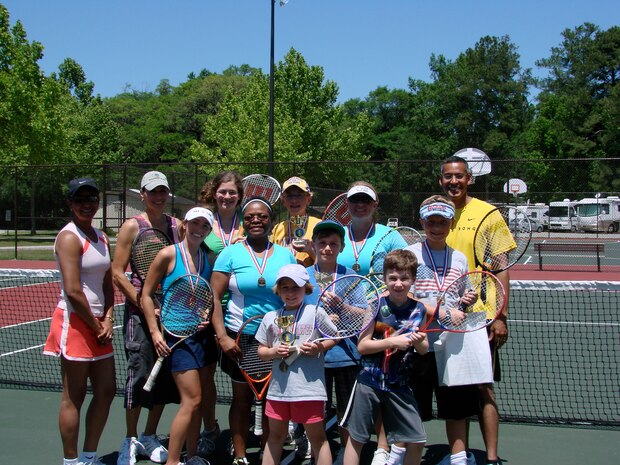 Joint Base Charleston Air Base Youth Programs hosted a tennis tournament at the JB CHS - AB tennis courts, April 30, as part of the Month of the Military Child activities. The participants trained with International Tennis Federation accredited level one coach Debbie Greene. Front row: Emma Harris and Elijah Harris; Middle Row (left to right): Laura King, Karen Hudson, Lars Espeland, Paul Espeland; Back Row (left to right) Debbie Greene, Lee Smith, Joanna Givens, Joe Espeland, Julie Harris and Chief Master Sgt. Terrence Greene, the 437th Airlift Wing command chief. (courtesy photo)