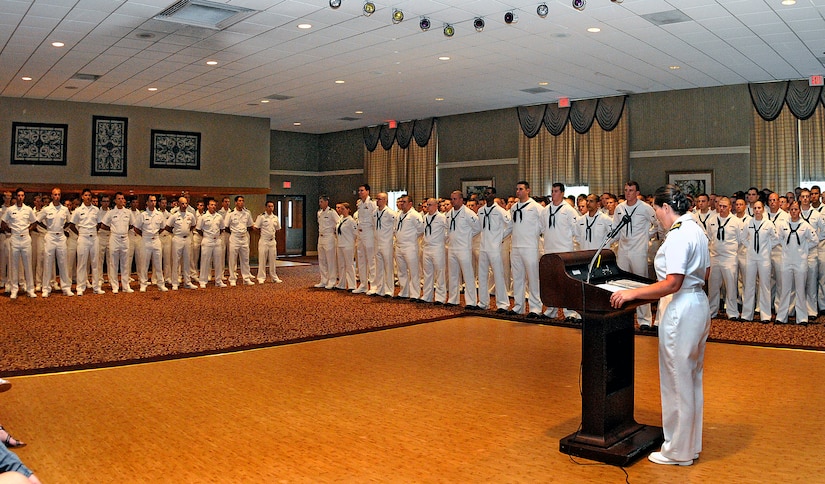 Nuclear Power Training Unit Executive Officer Lt. Cmdr. Erica Hoffman gives opening remarks congratulating more than 200 Sailors during a graduation ceremony held at the Red Bank Club at Joint Base Charleston, April 29. NPTU is the final training phase for Sailors in the nuclear field prior to receiving their official orders to a submarine or nuclear powered aircraft carrier. (U.S. Navy photo/Mass Communication Specialist 1st Class Jennifer Hudson)