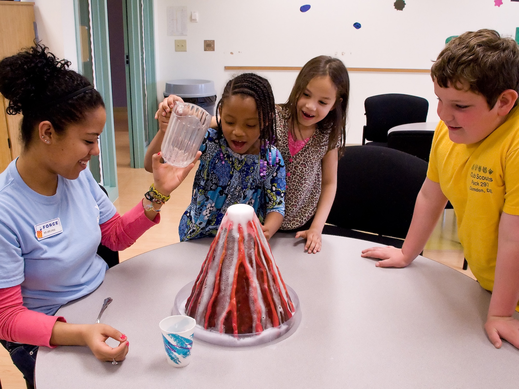 Children try an adult supervised experiment May 2, 2011, at the Dover Air Force Base, Del., Youth Center. The Youth Center is holding a summer camp program June 20 – Aug. 19 which is designed to engage the attendees both mentally and physically.  (U.S. Air Force photo by Adrian Rowan)