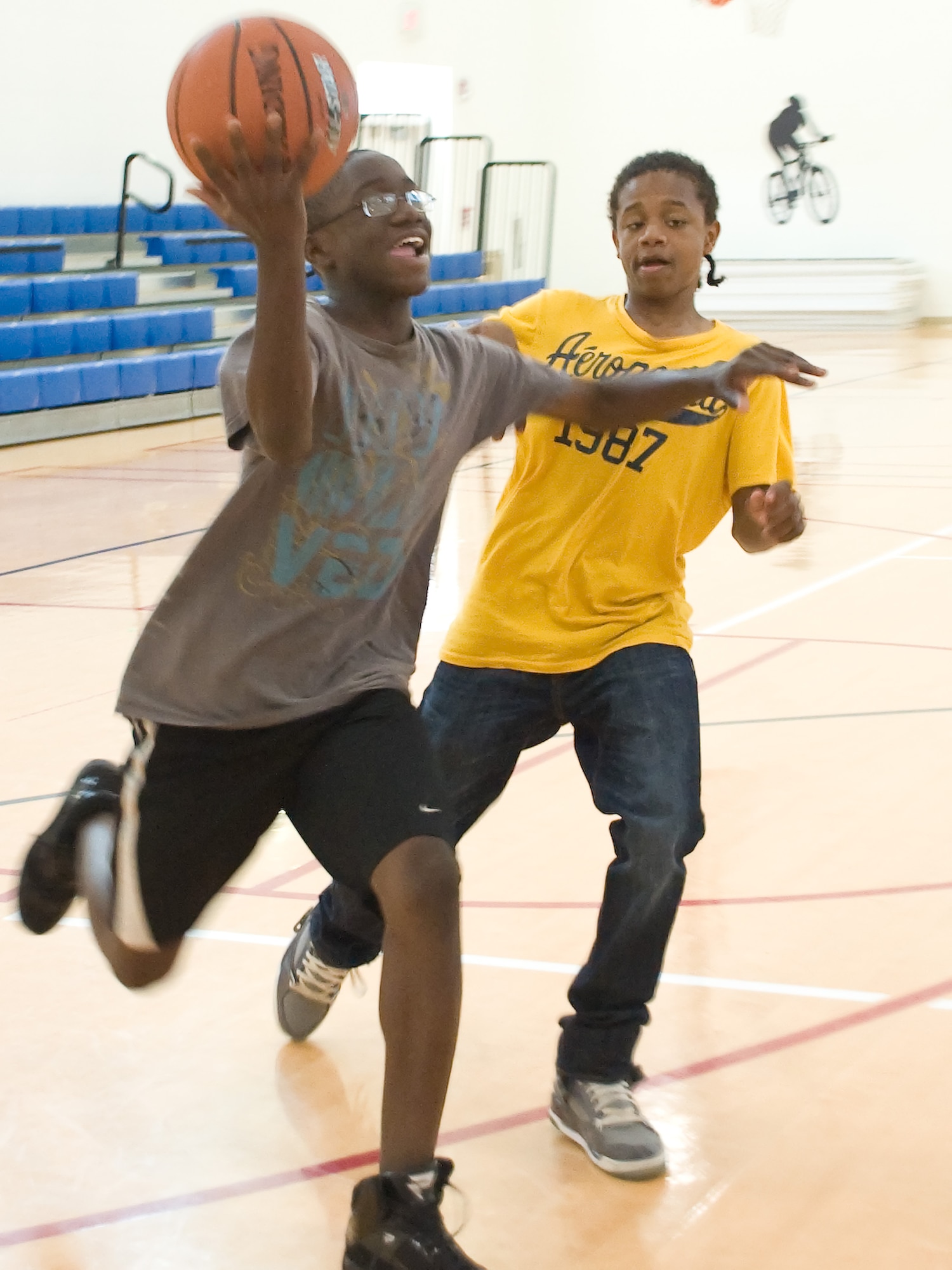 Michael Flammer attempts a layup while Keondere Robinson defends during a pickup game May 2, 2011, at the Dover Air Force Base, Del., Youth Center. Basketball and other sports will be one of the many programs offered by the Youth Center’s Summer Camp program, held June 20 – Aug. 19.  (U.S. Air Force photo by Adrian Rowan)