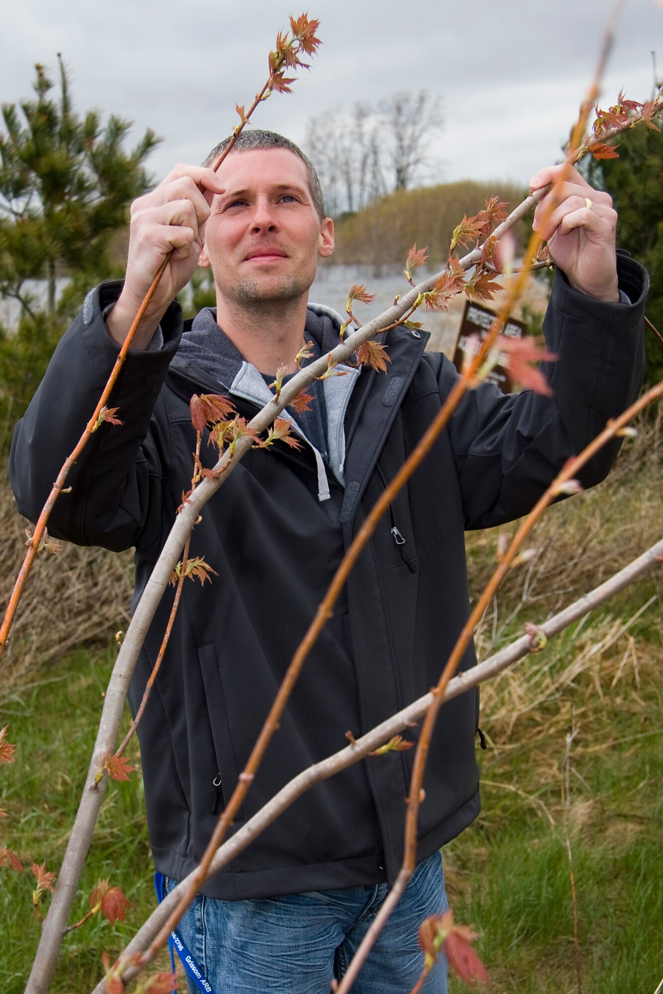 GRISSOM AIR RESERVE BASE, Ind. -- Cory Walters, 434th Civil Engineer Squadron biological scientist, examines new growth on a red maple located in Grissom's wetlands April 20. Mr. Walters, along with other 434th CES members, monitor and protect the base's environment through a variety of programs including air, water, cultural and natural resources, restoration, recycling, and pollution prevention. (U.S. Air Force photo/Tech. Sgt. Mark R. W. Orders-Woempner)
