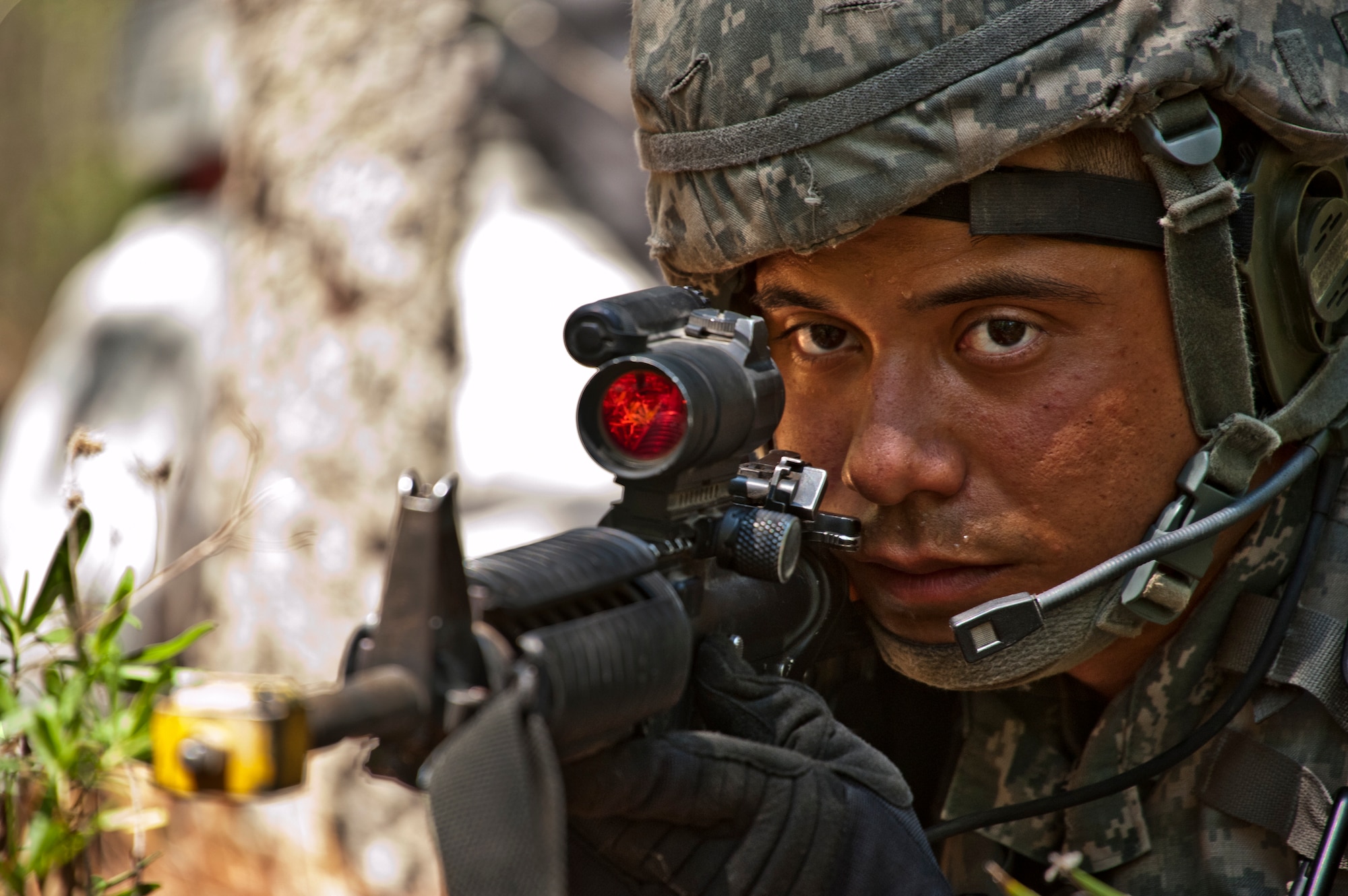 A technical sergeant watches and waits for word from his scouting team during an ‘outside the wire’ exercise April 28 at Eglin Air Force Base, Fla.  This was part of Air Force Materiel Command’s "Brave Defender" training, which is administered by the 96th Ground Combat Training Squadron.   The goal for their exercise was to use land navigation techniques to find a weapons cache based on the intelligence they were given.  GCTS instructors push 10 training classes a year, which consists of improvised explosive device detection and reaction, operating in an urban environment, mission planning, land navigation and casualty care.  The three-week training culminates with a three-day field training exercise where the Airmen apply what they learned in combat scenarios.  More than 140 Airmen from more than 10 locations attended this training.  (U.S. Air Force photo/Samuel King Jr.)