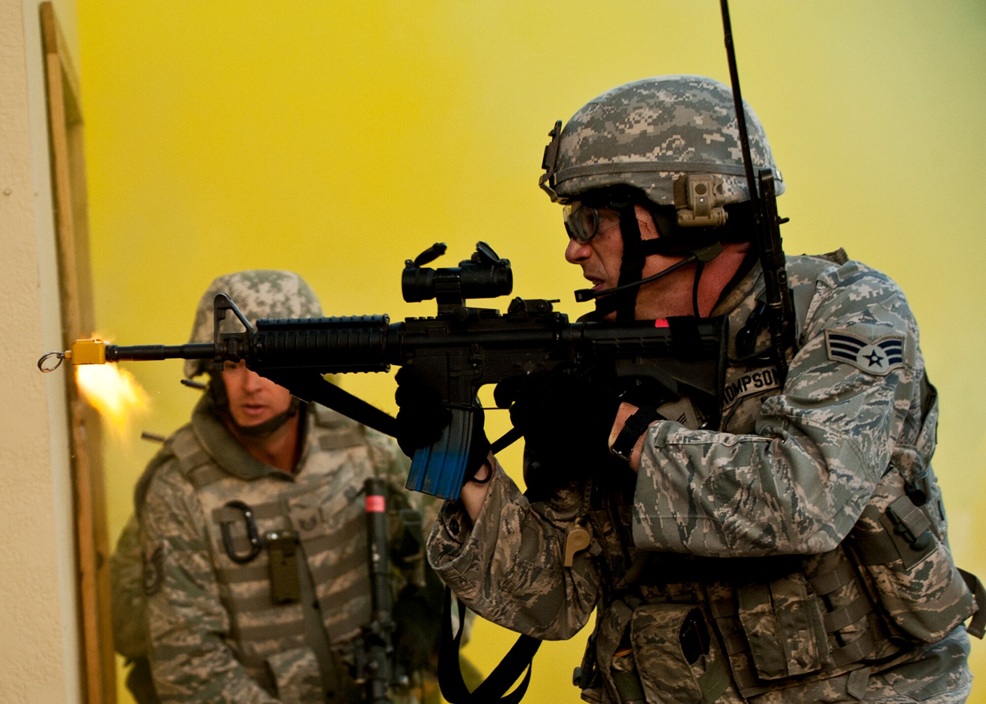Senior Airman Benjamin Thompson, 375th Security Forces Squadron, opens fire as he moves away from the building during a raid on a village as part of an exercise April 29 at Eglin Air Force Base, Fla.  Based on intelligence gathered, two squads entered the village in search of a high value target.  This was part of Air Force Materiel Command’s "Brave Defender" training, which is administered by the 96th Ground Combat Training Squadron.  GCTS instructors push 10 training classes a year, which consists of improvised explosive device detection and reaction, operating in an urban environment, mission planning, land navigation and casualty care.  The three-week training culminates with a three-day field training exercise where the Airmen apply what they learned in combat scenarios.  More than 140 Airmen from more than 10 locations attended this training.  (U.S. Air Force photo/Samuel King Jr.)