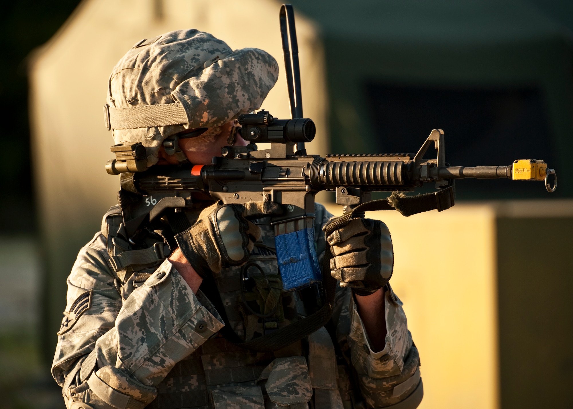 Senior Airman Bobby Mullinnix, 82nd Security Forces Squadron, takes aim at a suspicious vehicle during a “mounted” patrol mission April 29 at Eglin Air Force Base, Fla.  This was part of Air Force Materiel Command’s "Brave Defender" training, which is administered by the 96th Ground Combat Training Squadron.  Teams of Airmen experienced both mounted (vehicle) and dismounted (foot) patrols through the forests and simulated villages around their base.  GCTS instructors push 10 training classes a year, which consists of improvised explosive device detection and reaction, operating in an urban environment, mission planning, land navigation and casualty care.  The three-week training culminates with a three-day field training exercise where the Airmen apply what they learned in combat scenarios.  More than 140 Airmen from more than 10 locations attended this training.  (U.S. Air Force photo/Samuel King Jr.)