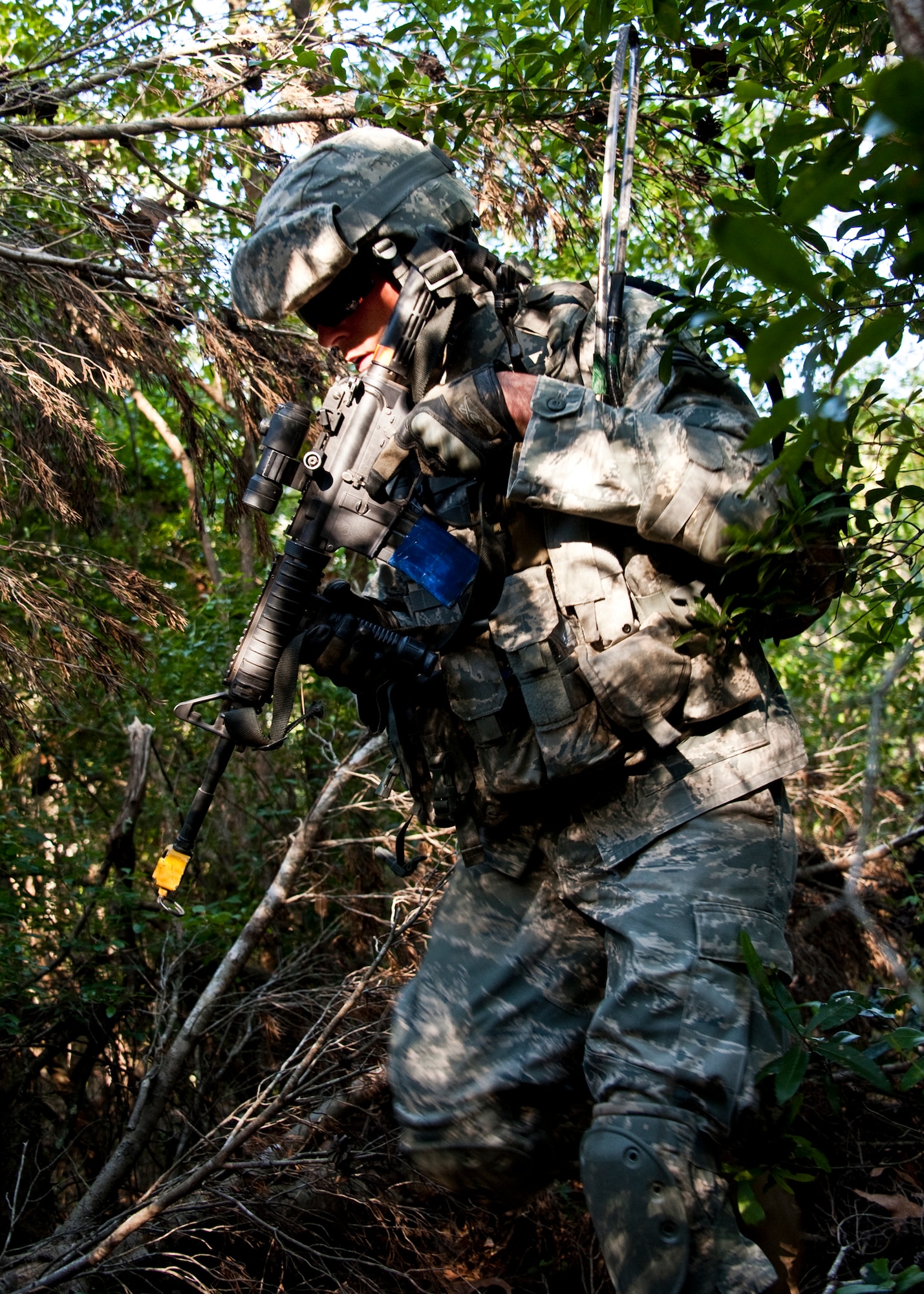 A security forces Airman moves through thick brush during a patrol after a “simulated” attack on their base April 29 at Eglin Air Force Base, Fla.  This was part of Air Force Materiel Command’s "Brave Defender" training, which is administered by the 96th Ground Combat Training Squadron.  GCTS instructors push 10 training classes a year, which consists of improvised explosive device detection and reaction, operating in an urban environment, mission planning, land navigation and casualty care.  The three-week training culminates with a three-day field training exercise where the Airmen apply what they learned in combat scenarios.  More than 140 Airmen from more than 10 locations attended this training.  (U.S. Air Force photo/Samuel King Jr.)