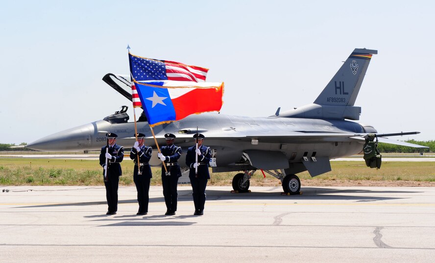 ABILENE, Texas ? Dyess Air Force Base Honor Guard presents the colors April 30 at the Dyess Big Country Airfest here. The airfest is held at Abilene Regional Airport every other year and features various aircraft performances as well as static displays. The airfest is held to bring the Abilene and Dyess communities together and to demonstrate Air Force capabilities. (U.S. Air Force photo/ Senior Airman Chelsea Cummings)