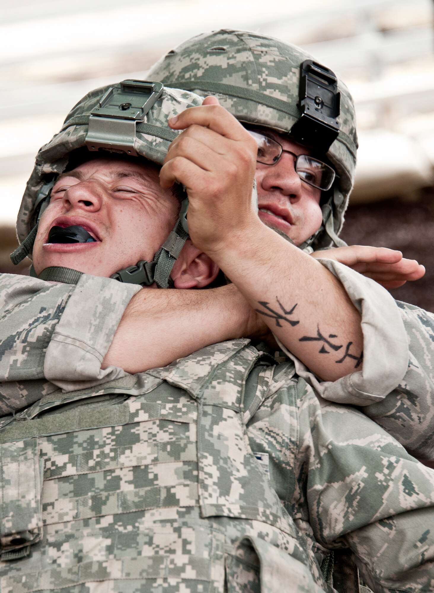 An Airman attempts to break out of a choke hold during a hand-to-hand combat class April 14 at Eglin Air Force Base, Fla.  This, along with the new Fly Away Security Team training were included in Air Force Materiel Command’s "Brave Defender" training,  which is administered by the 96th Ground Combat Training Squadron.  Although not part of the overall course, GCTS provided the specialized training to those Airmen who were required to have it prior to deploying.   More than 140 Airmen from more than six major commands attended the three-week course.  (U.S. Air Force photo/Samuel King Jr.)  
