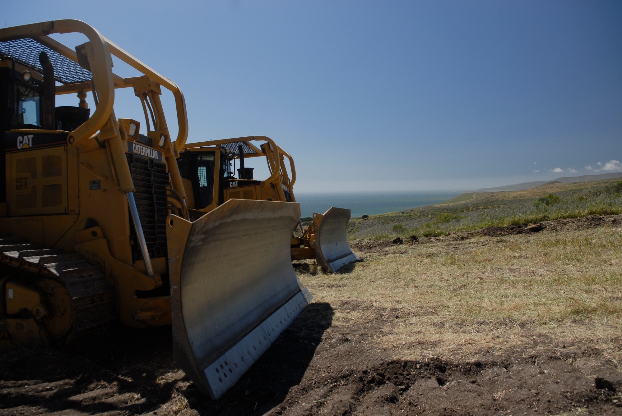 VANDENBERG AIR FORCE BASE, Calif. -- Two bulldozers rest after being used during the Fire Dozer Academy training here Thursday, April 28, 2011.  (U.S. Air Force photo/Staff Sgt. Andrew Satran) 

 
 
 
 
 
   