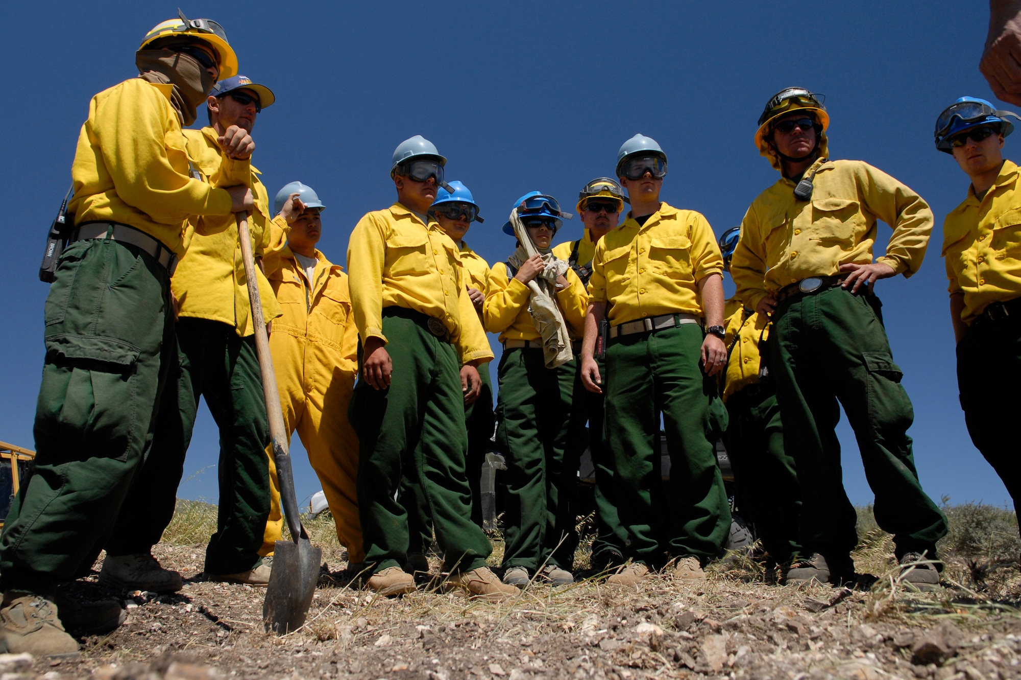 VANDENBERG AIR FORCE BASE, Calif. -- Members from the 30th Civil Engineer Squadron Fire Dozer Academy training receive a safety briefing here Thursday, April 28, 2011.  Team members learn how to create fire breaks, which help impede the spread of brush fires.  (U.S. Air Force photo/Staff Sgt. Andrew Satran) 

  