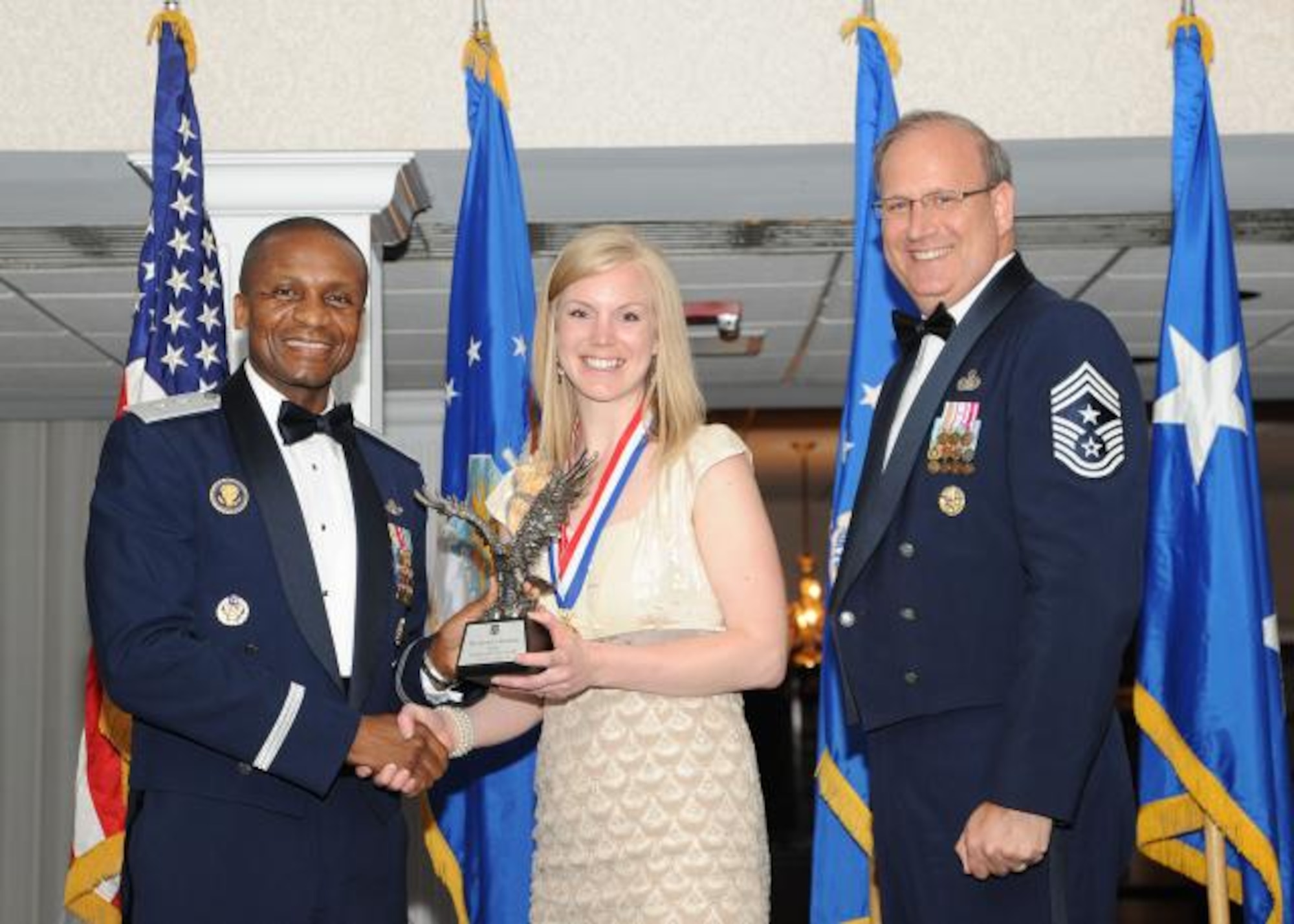 Air Force District of Washington Commander, Maj. Gen. Darren McDew and Chief Master Sgt. Pat Battenberg, AFDW command chief presented Ms. Jessica Kasper, AFDW budget and analyst specialist the AFDW Category lll Civilian of the Year Award. Ms. Kasper also was awarded the Civilian Volunteer of the Year Award during the AFDW Annual Awards Banquet held April 29, at The Club, Joint Base Anacostia-Bolling, Washington, D.C. (US Air Force photo by Senior Airman Matthew Coleman-Foster)