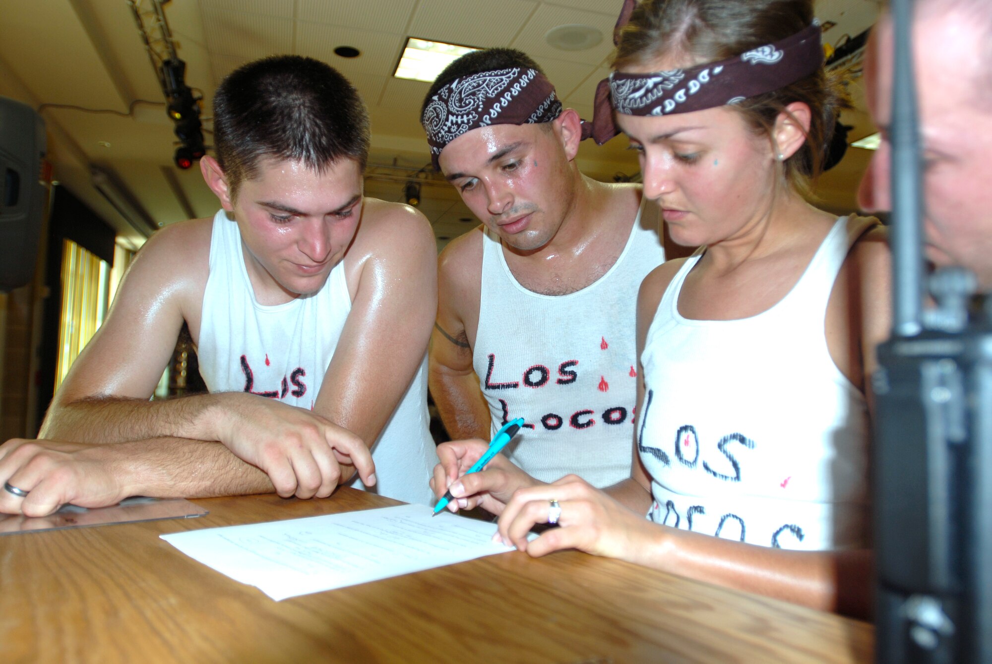 GOODFELLOW AIR FORCE BASE, Texas—The winning team “Los Locos,” race to complete the final task of the SARC Challenge, April 30. After running the nearly five mile course and completing 11 other challenges, each team had to complete a quiz on the sexual assault facts they learned during the race. (U.S. Air Force photo/Airman 1st Class Jessica Keith)