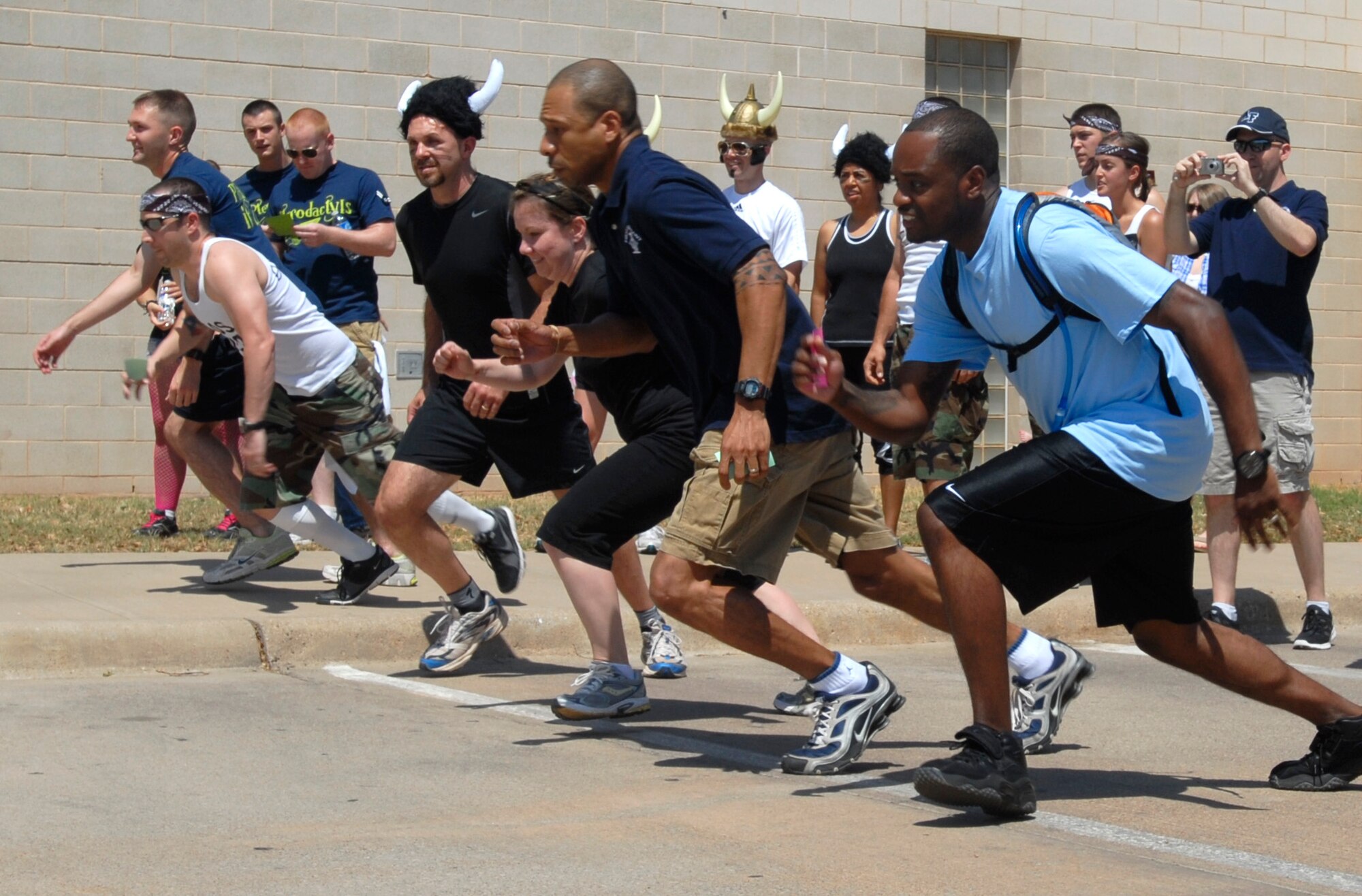 GOODFELLOW AIR FORCE BASE, Texas—Teams participating in the SARC Challenge charge into action in search of their first clue April 30.  Each clue, which leads to one of 12 stations with a unique task that must be completed, also contains facts about Sexual Assault Awareness. (U.S. Air Force photo/Airman 1st Class Jessica Keith)