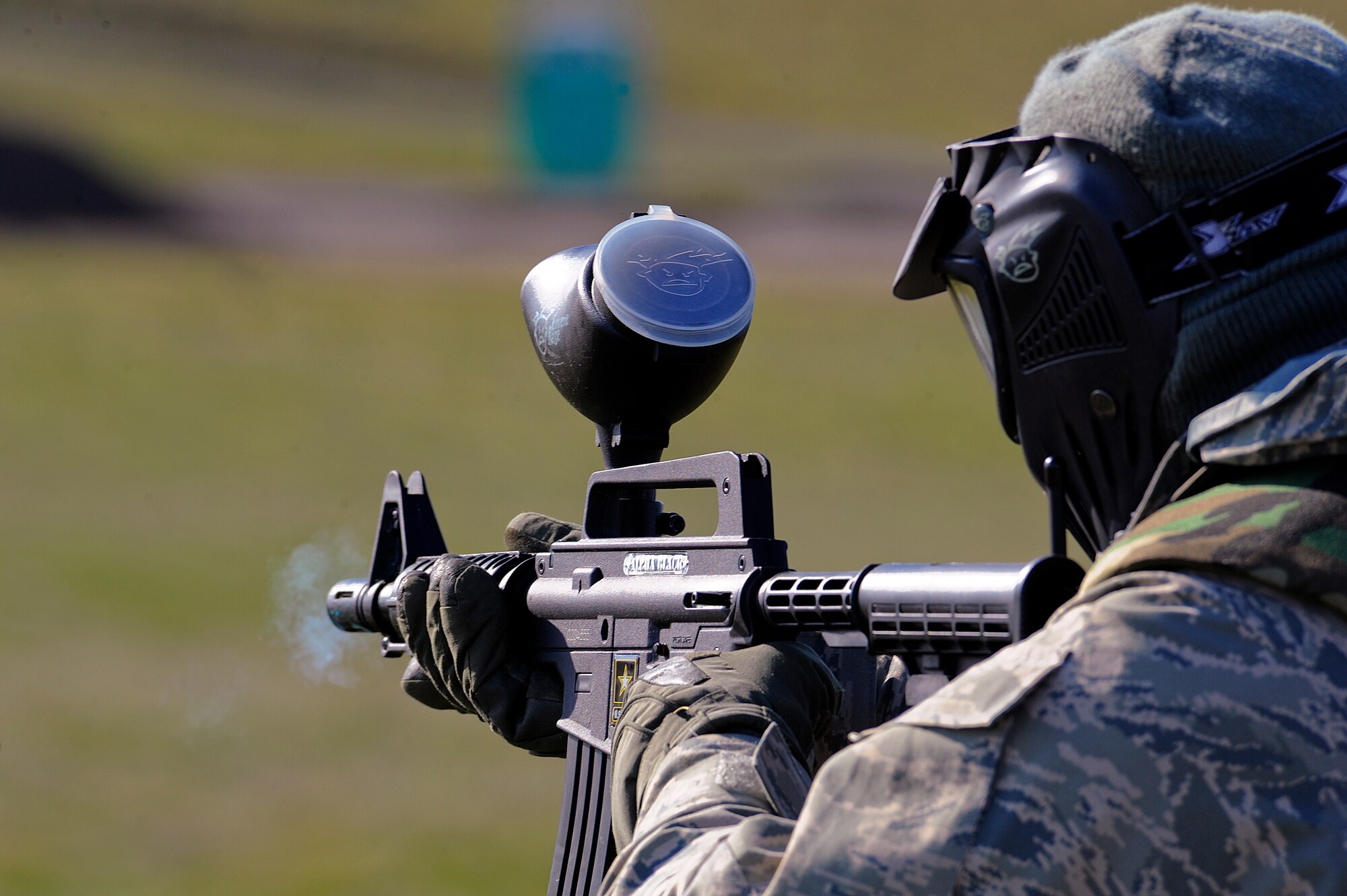 A 92nd Civil Engineering Squadron member returns fire to an enemy using a paint ball rifle. The Participants in the exercise where exposed to simulated threats such as vehicle-borne improvised explosive devices, mortars and base attacks. The exercise was intended to give Airmen a real life sense of dangers they may face in a deployed location. (U.S. Air Force Photo/Tech. Sgt. JT May III)

