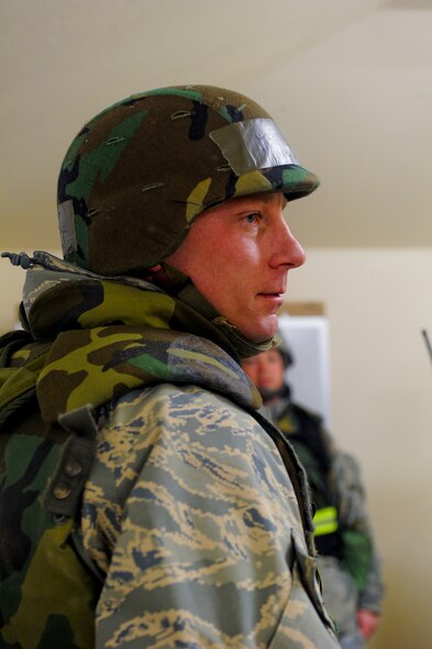 Master Sgt. David Lawrence, 92nd Civil Engineering Squadron superintendent of operations support, listens to vital information in the Unit Control Center (UCC) duringn a field training exercise April 22, 2011, at at Fairchild Air Force Base, Wash. The purpose of this training was to simulate real time training in the battlefield. The 92nd CES conducted an a four-day exercise for members of the unit to give each Airmen a better picture of what is expected of them in a combat environment. (U.S. Air Force Photo/Tech. Sgt. J.T. May III)