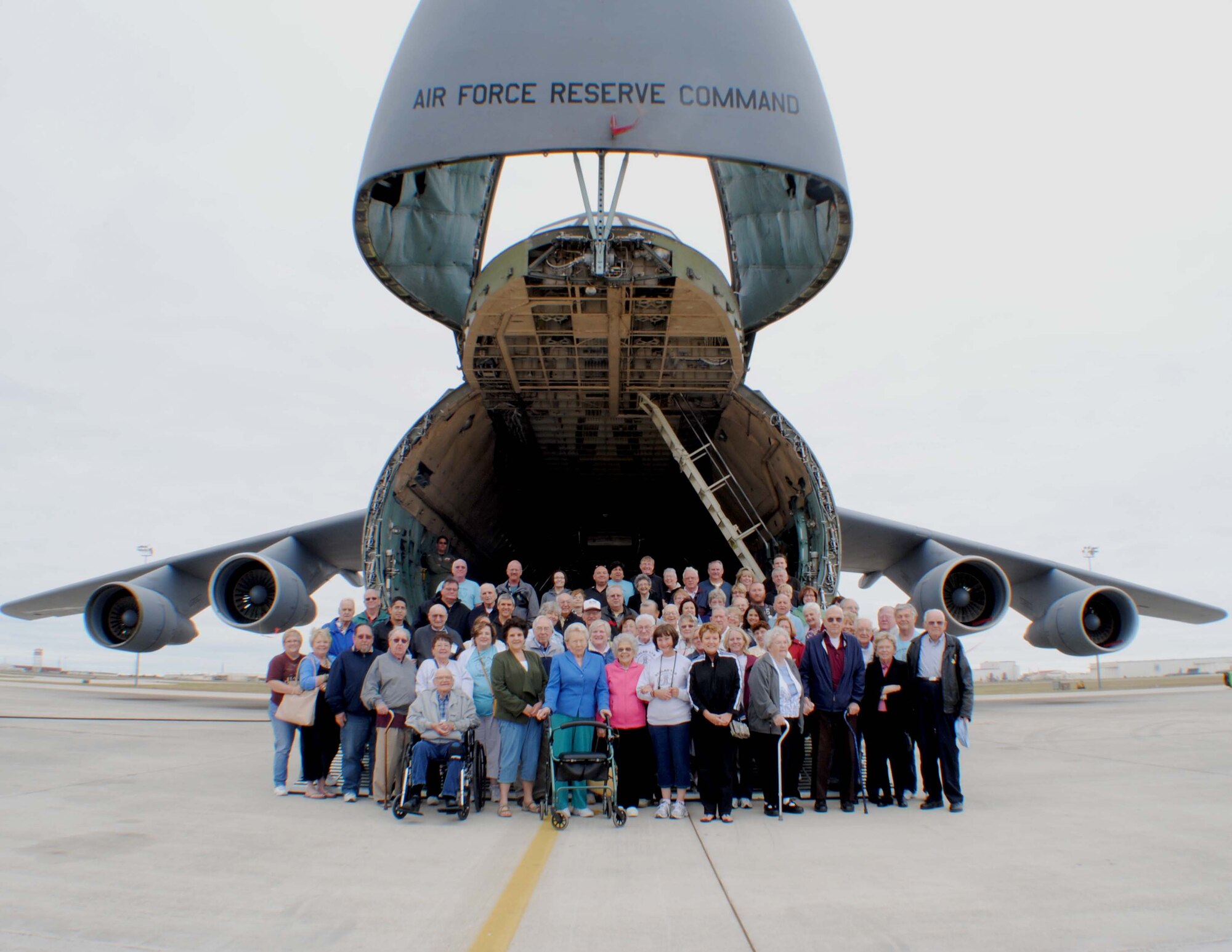 Members from Hogan’s Heroes reunion tour and family members pose for a group photo on the front loading ramp of a C-5 Galaxy military cargo jet, May 2, 2011 at Lackland Air Force Base, Texas. Hogan’s Heroes is a group of former American prisoners of war who, in 1943, were interned at the concentration camp known as Stalag 17B in Krems, Austria. Their visit is part of the group’s annual reunion that in 2011 celebrates their 67th year of liberation from the German Nazi forces. (U.S. Air Force photo/Senior Airman Luis Loza Gutierrez)
